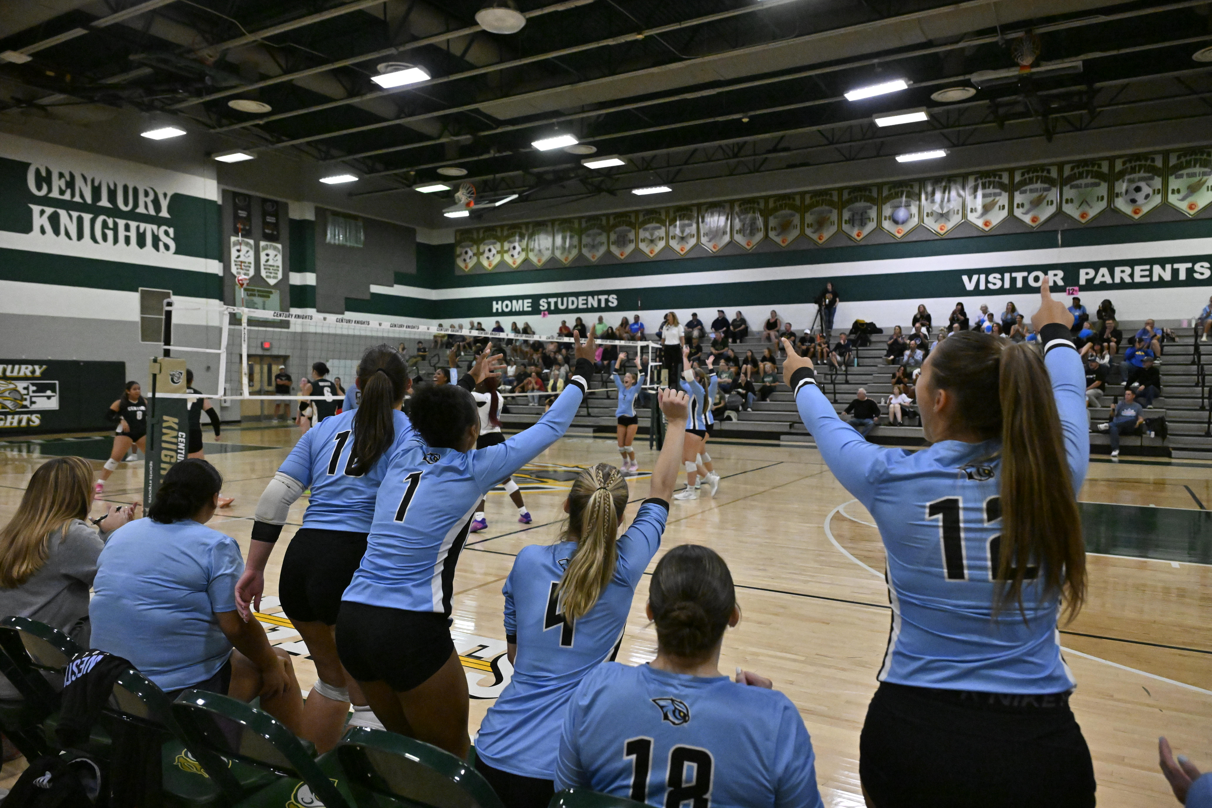The Westminster bench celebrates winning the first game during a...