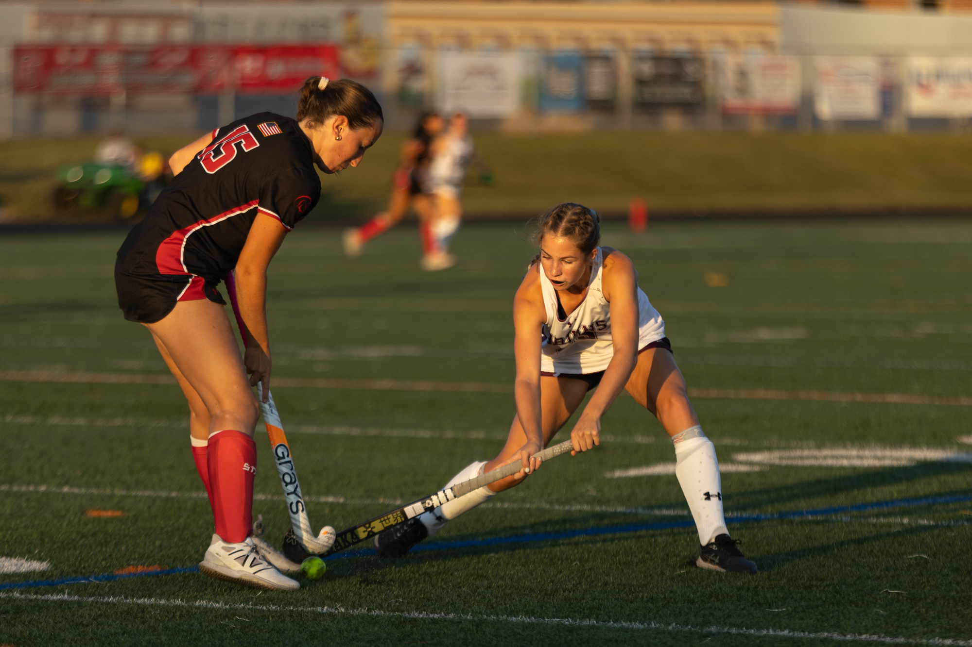 Lizzie Hall, right, attempts to make a steal on Kaitlyn...