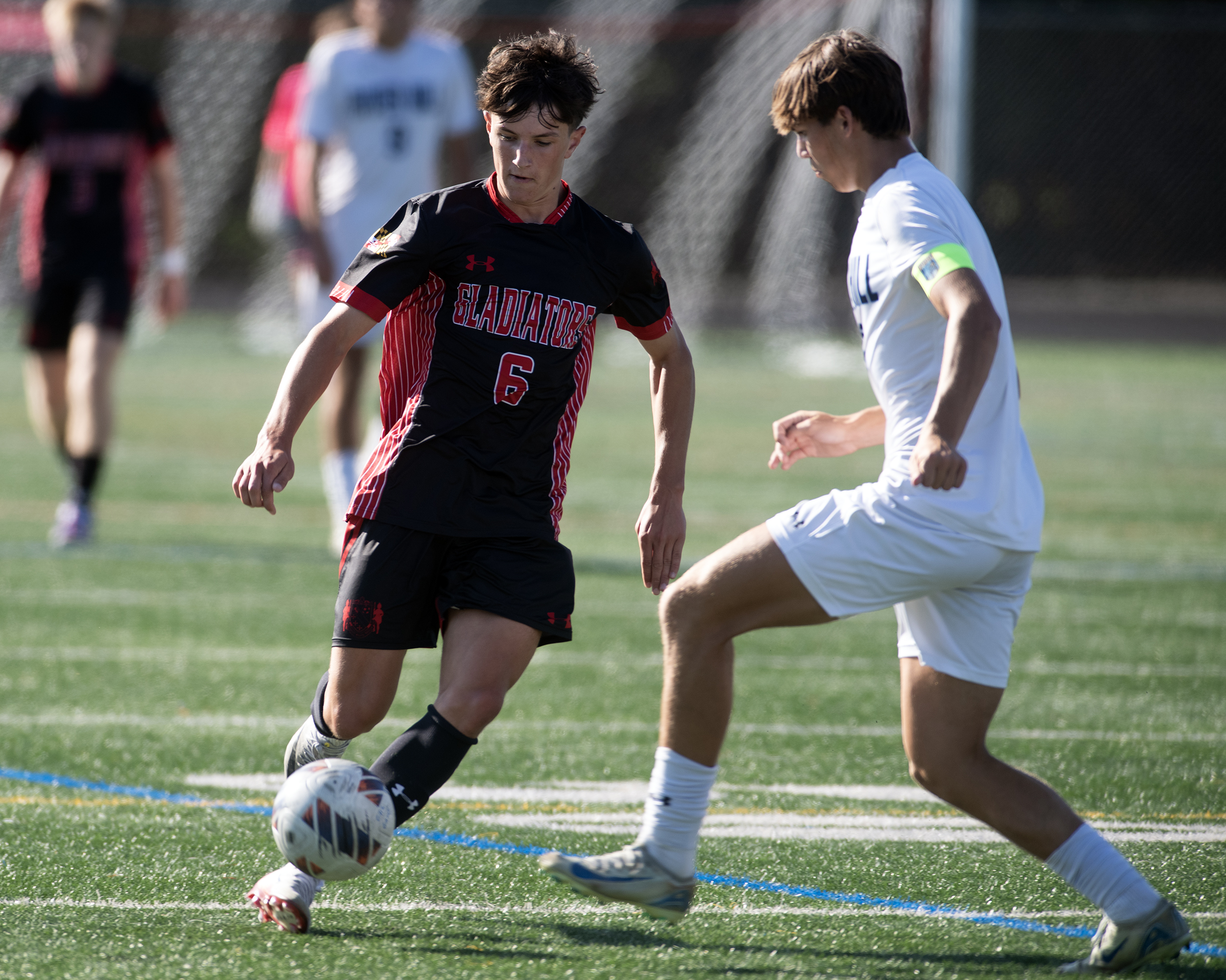 Sept. 8, 2025- Glenelg's Andrew Kasbeer-Betty, left, moves the ball...