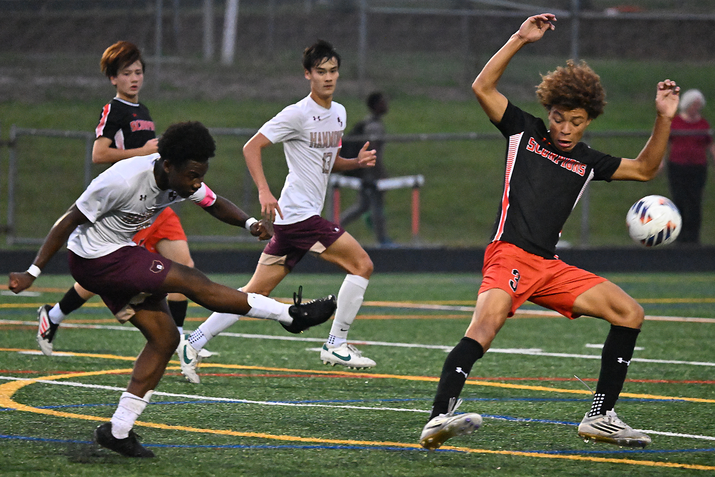 Hammond #10, Owen Bangassi, attempts a shot on goal in...