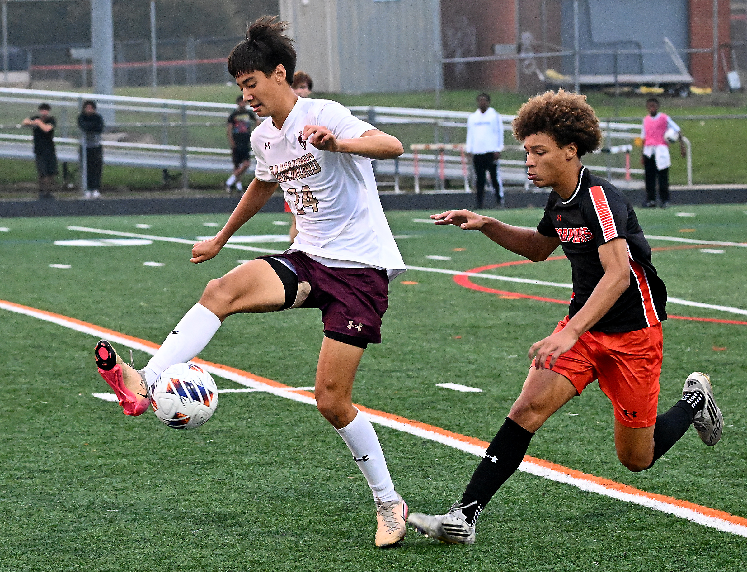 Hammond #24, Kruz Heredia, pushes the ball forward in the...