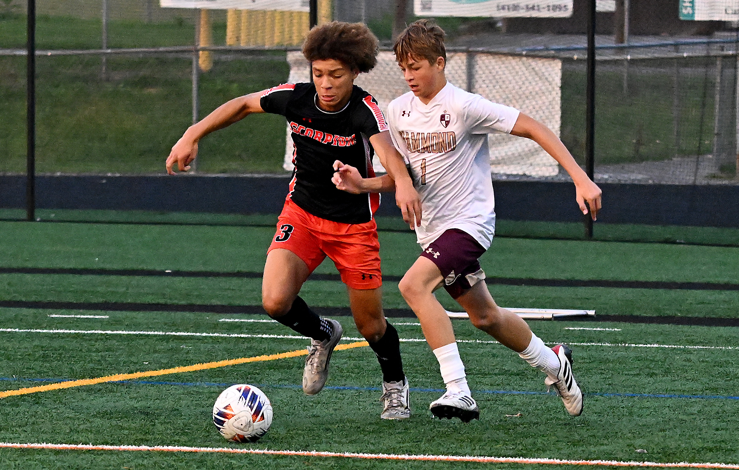 Oakland Mills' Keegan Rembert, left, and Hammond's Conrad Westfall battle...