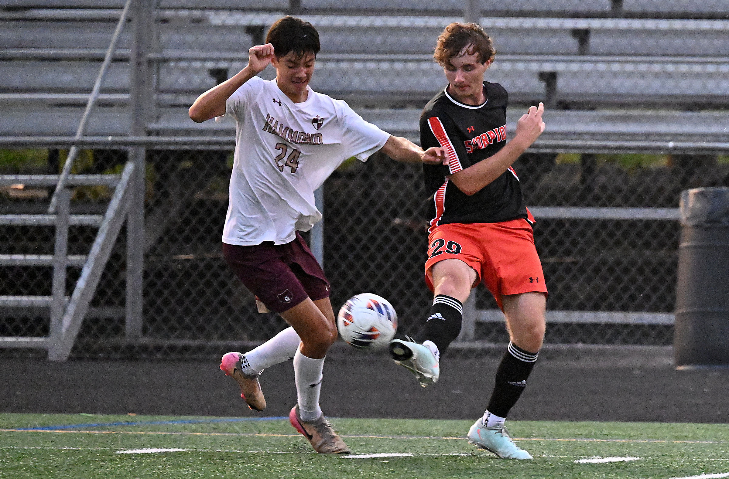 Oakland Mills #29, Lorenzo Zangle, passes the ball in the...