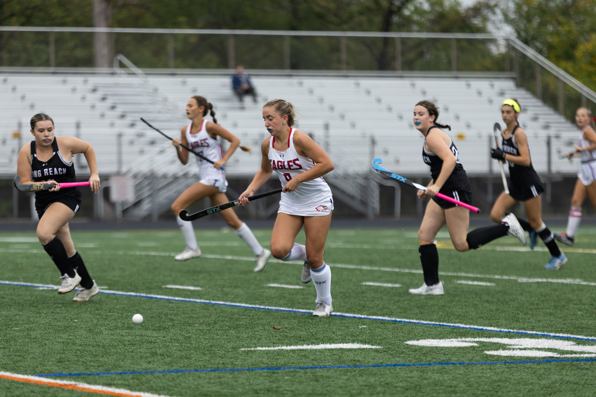 Centennial’s Claire Whipkey moves the ball upfield during the game...
