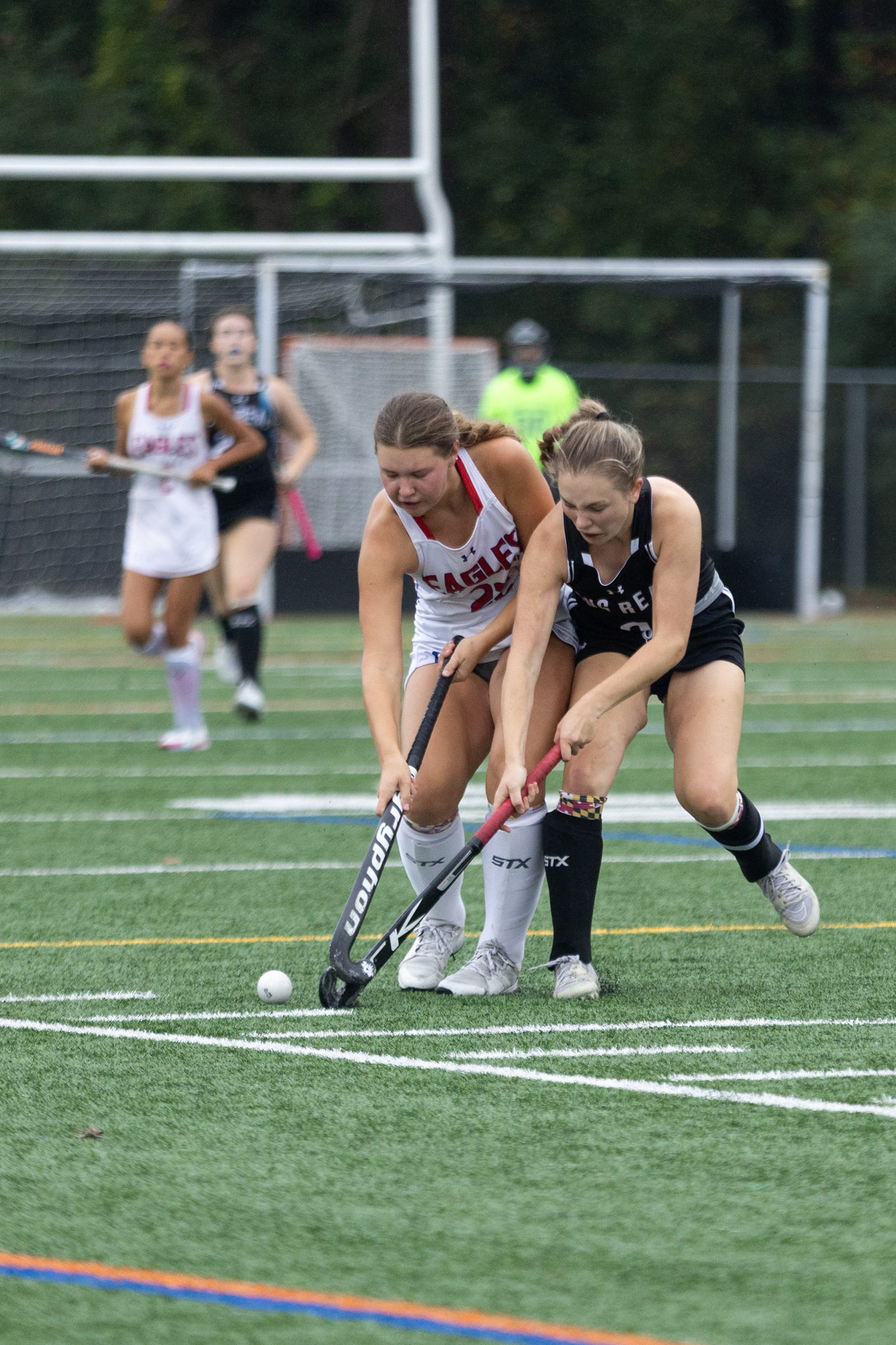 Centennial’s Lucy Smith and Jill Shanley collide during the game...