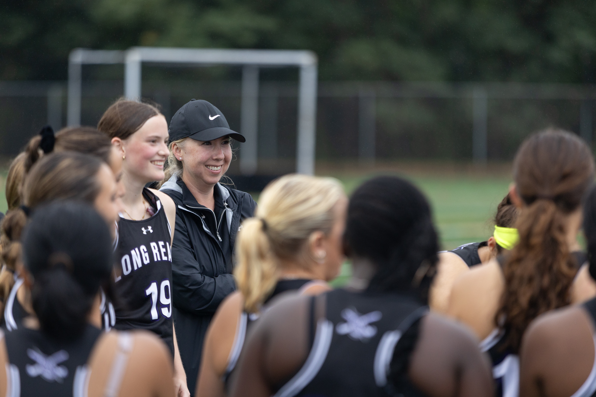 Long Reach head coach Stephanie De Wit gathers with the...
