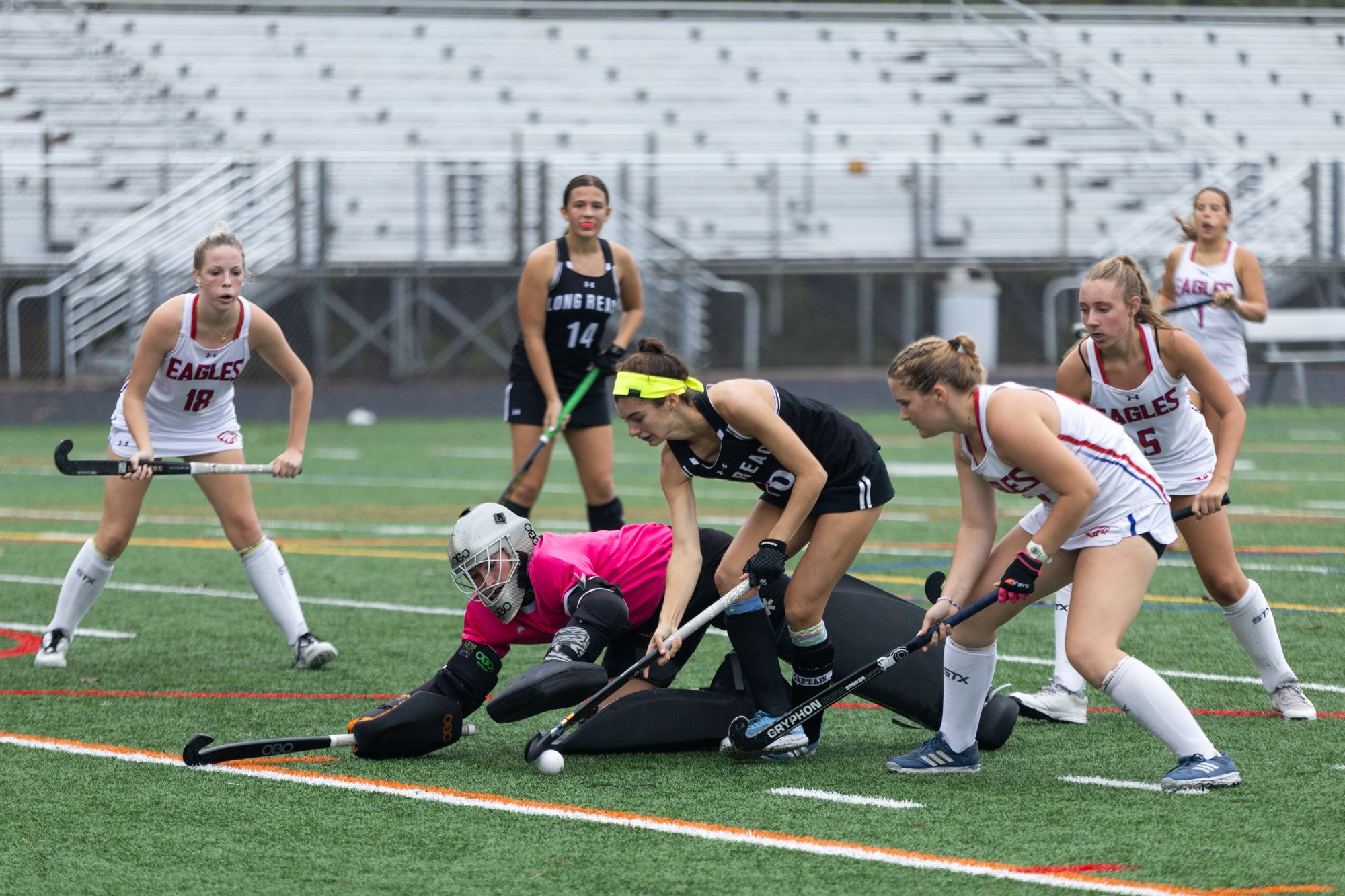 Centennial goalie Jane Baldy makes a save against Samantha Legge...
