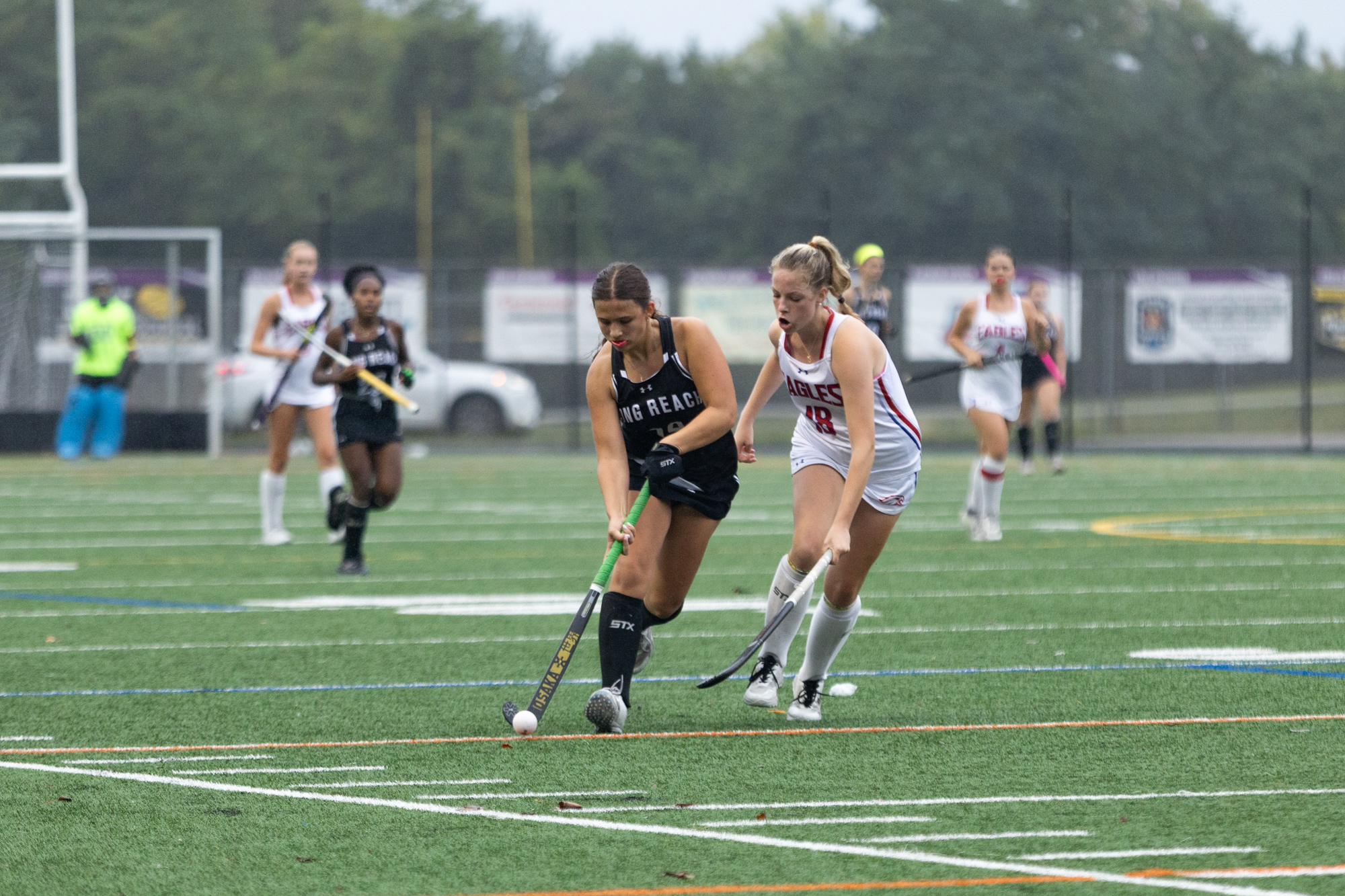 Long Reach’s Morgan Reynolds chips the ball past Maddie Stachera...