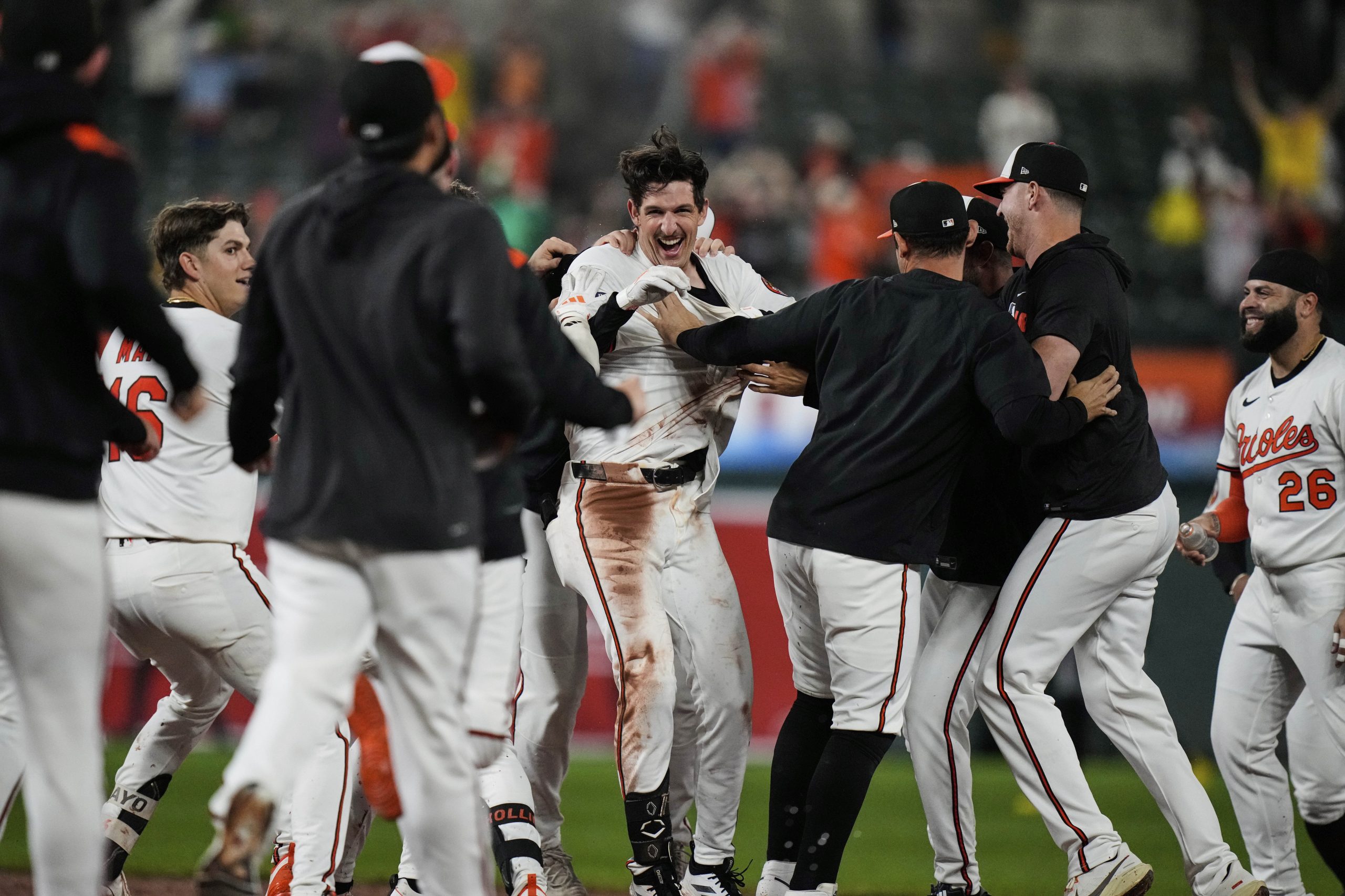 Baltimore Orioles' Dylan Beavers, center, celebrates with teammates after hitting...