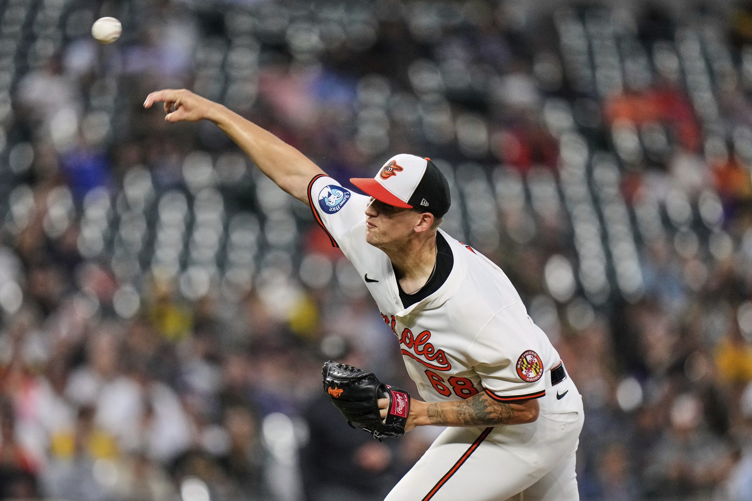 Baltimore Orioles starting pitcher Tyler Wells (68) delivers during the...