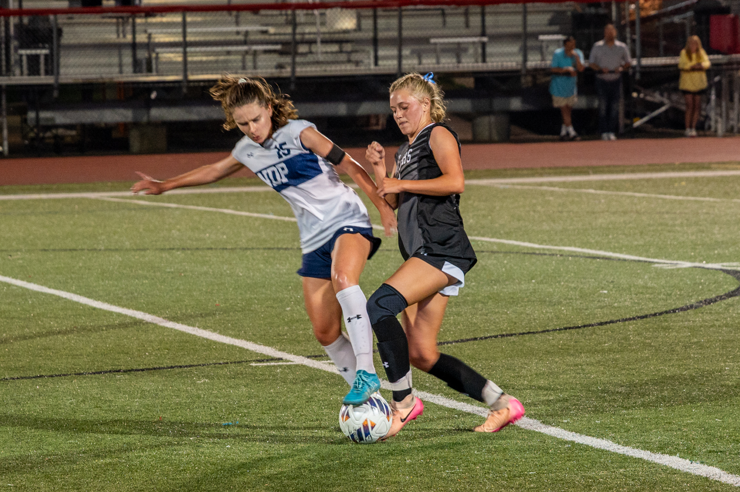 Notre Dame’s Tess McCarthy and Spalding’s Sophie Bresnan compete for...