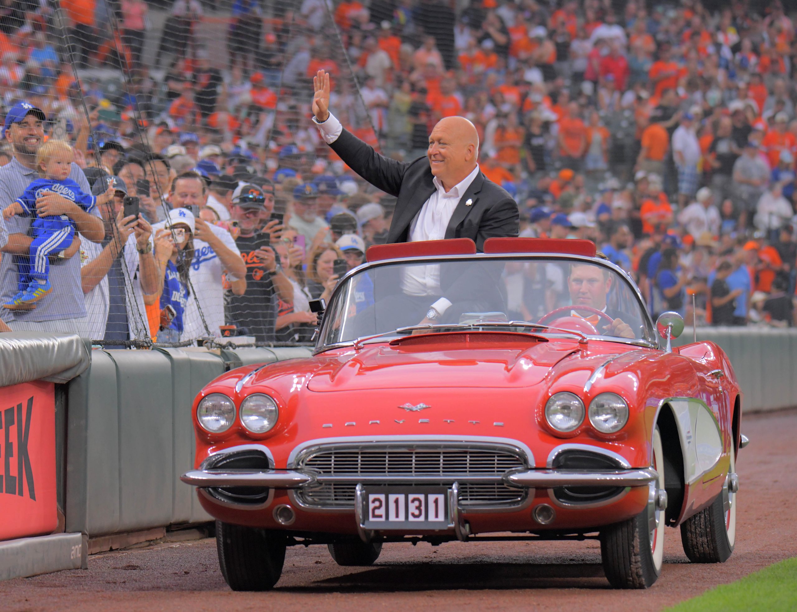 Cal Ripken Jr. rides in a convertible during a celebration...
