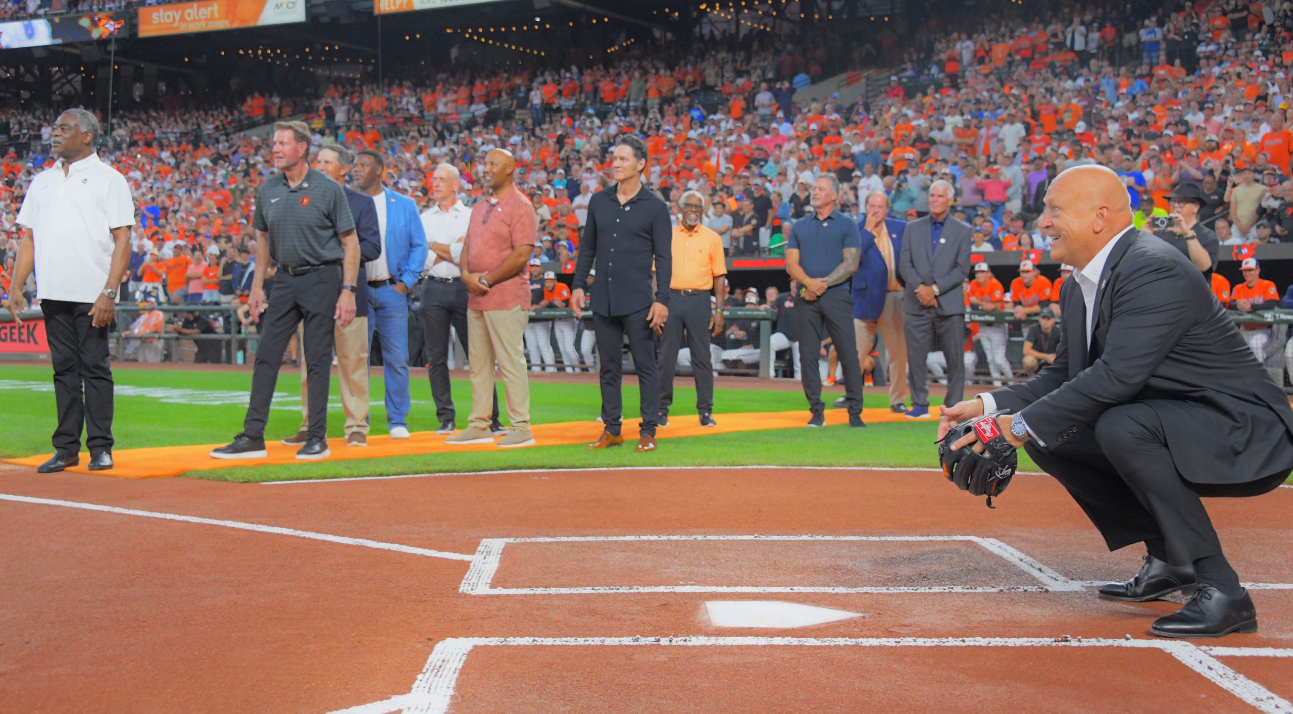 Retired Baltimore Orioles players and other invited guests watch Cal...