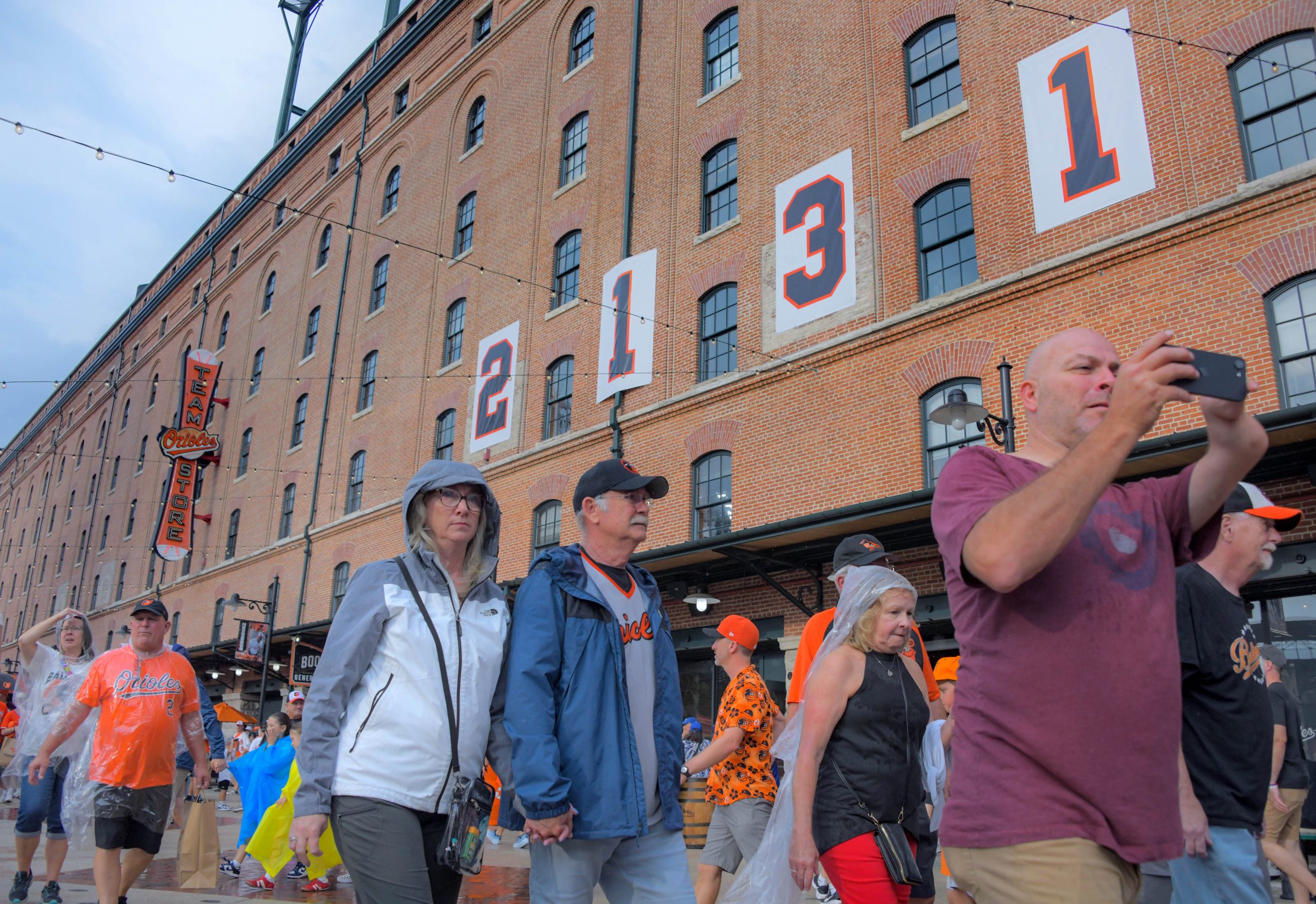 Fans enter beneath the historic numbers hanging outside of the...