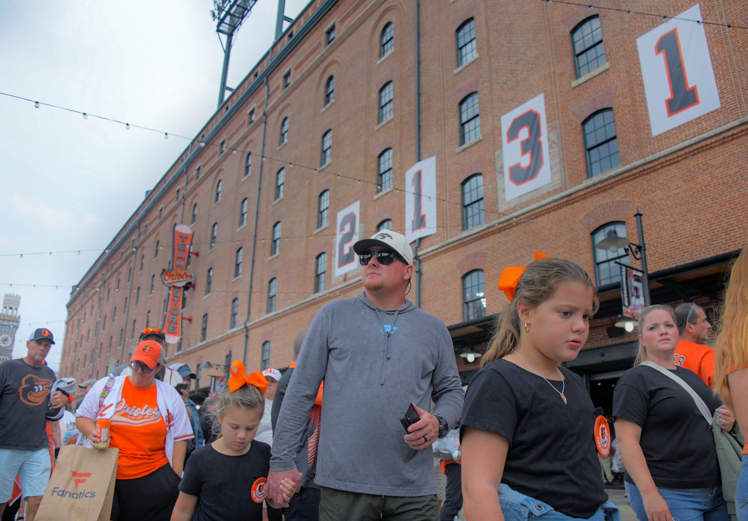 Fans enter beneath the historic numbers hanging outside of the...