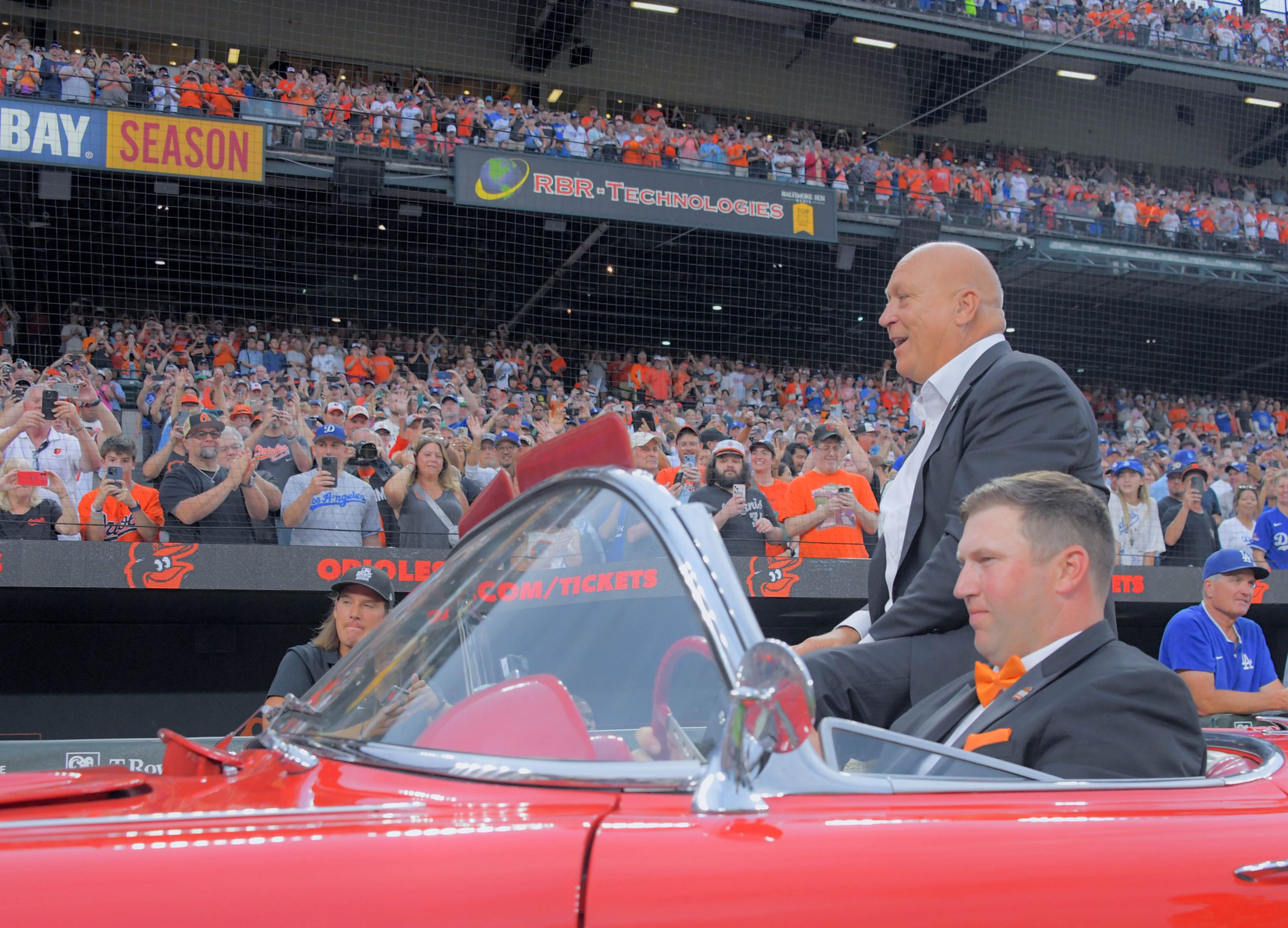 Cal Ripken Jr. rides in a convertible during a celebration...