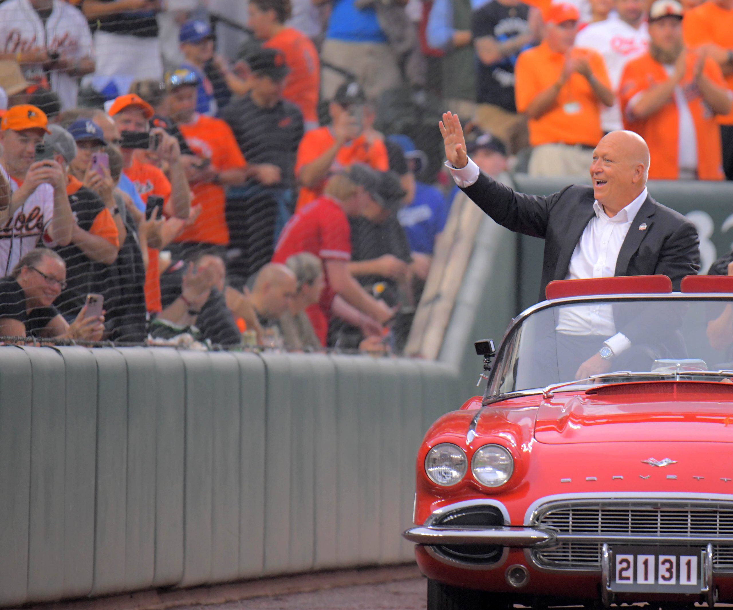 Cal Ripken Jr. rides in a convertible during a celebration...