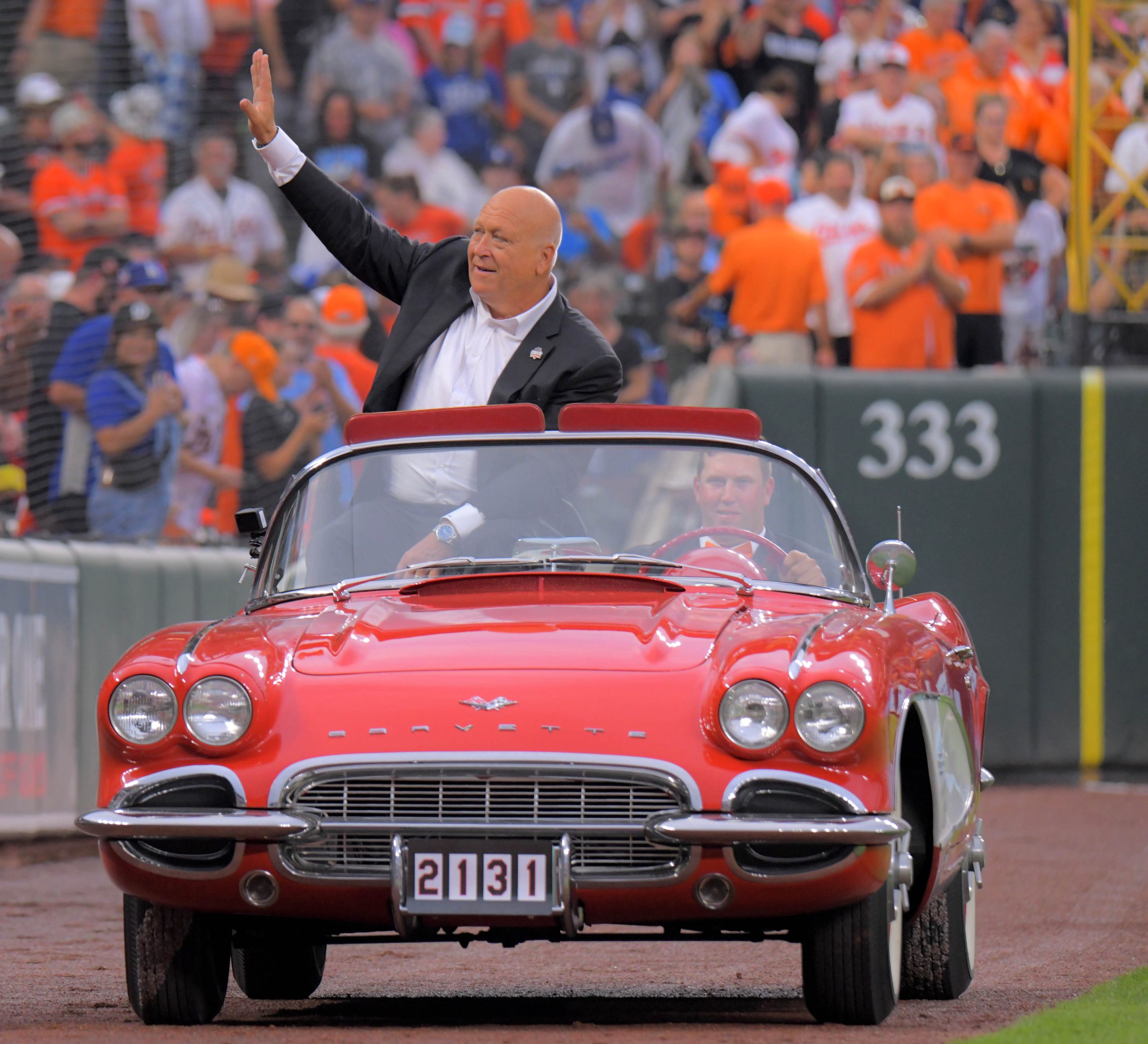 Cal Ripken Jr. rides in a convertible during a celebration...