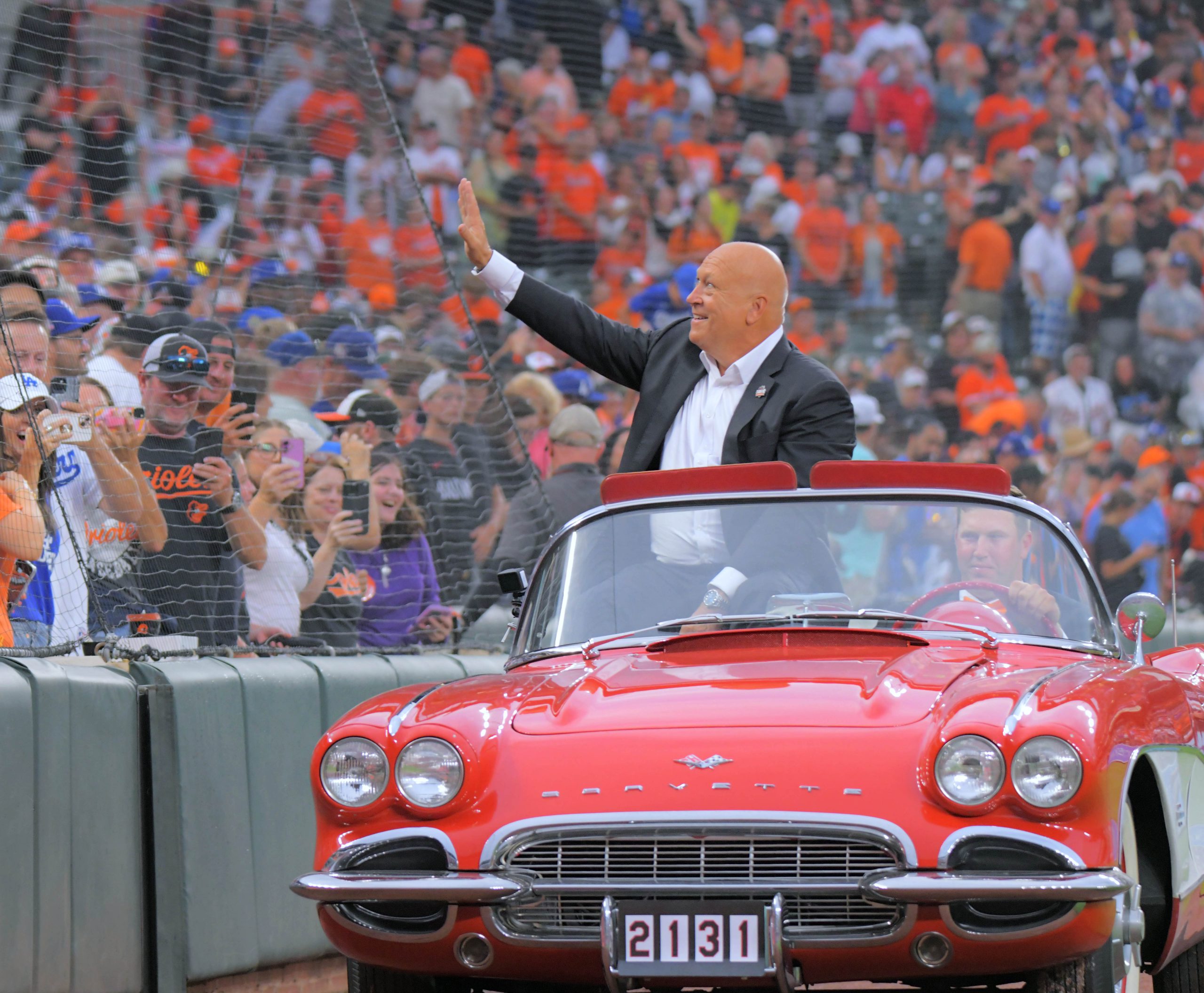 Cal Ripken Jr. rides in a convertible during a celebration...
