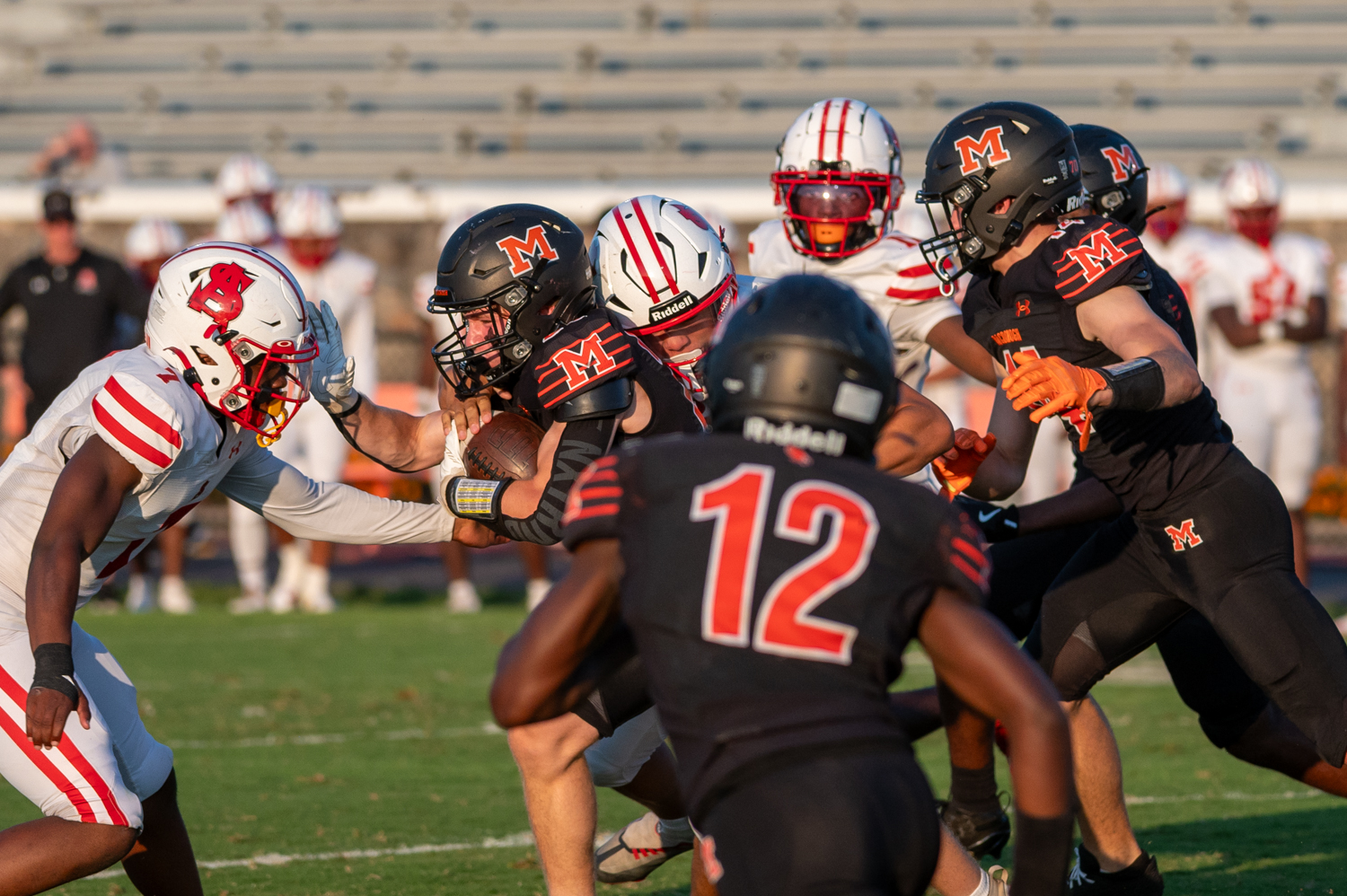 McDonogh’s Aidan Zoeller gets tackled as he attempts to push...