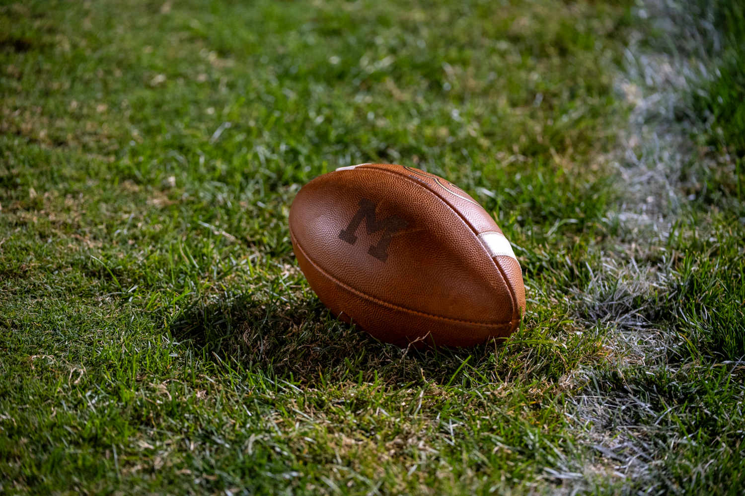 A McDonogh marked football lays to the side, dropped by...