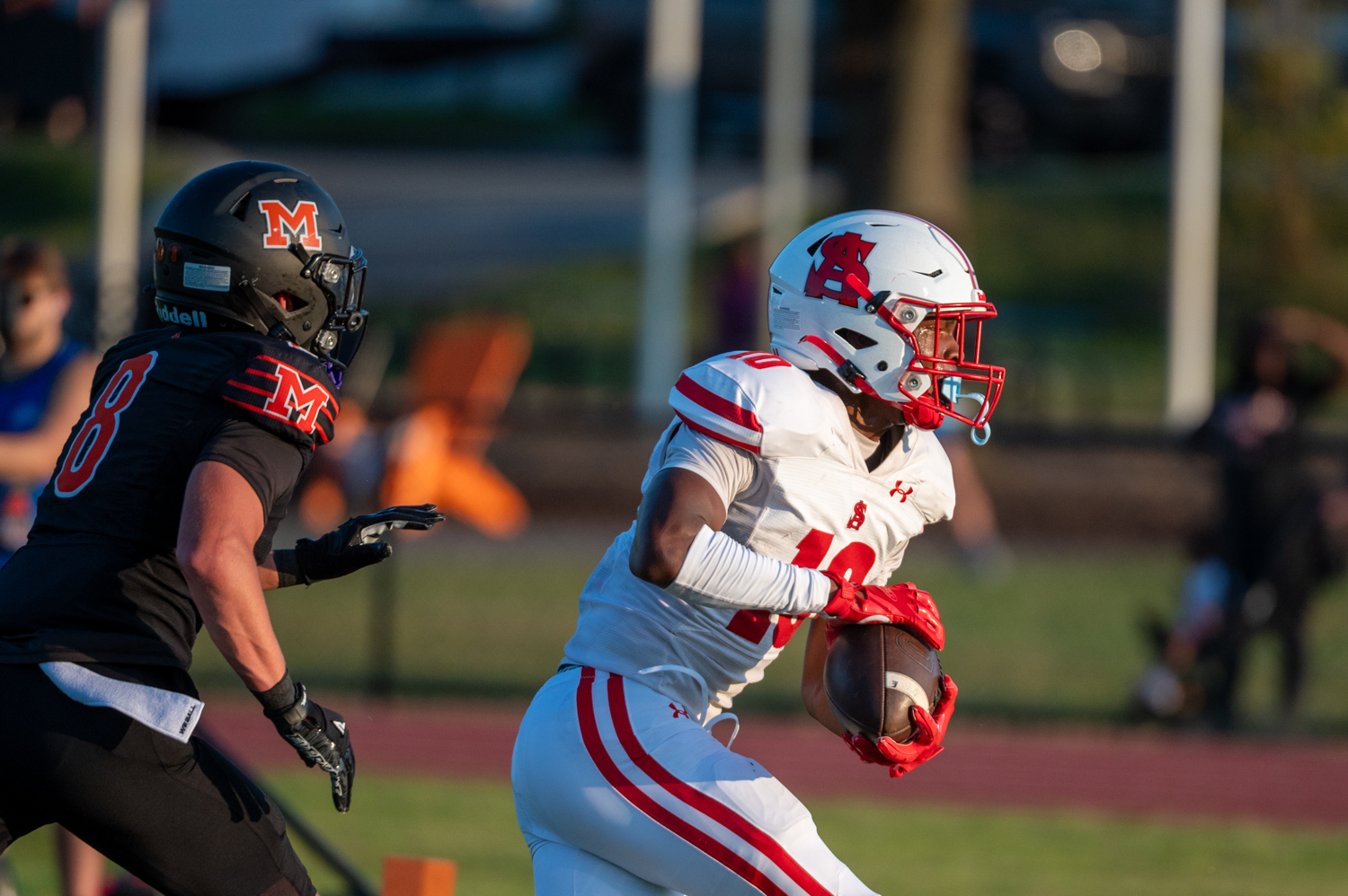 Spalding wide receiver David Ledbetter scores a touchdown past McDonogh’s...