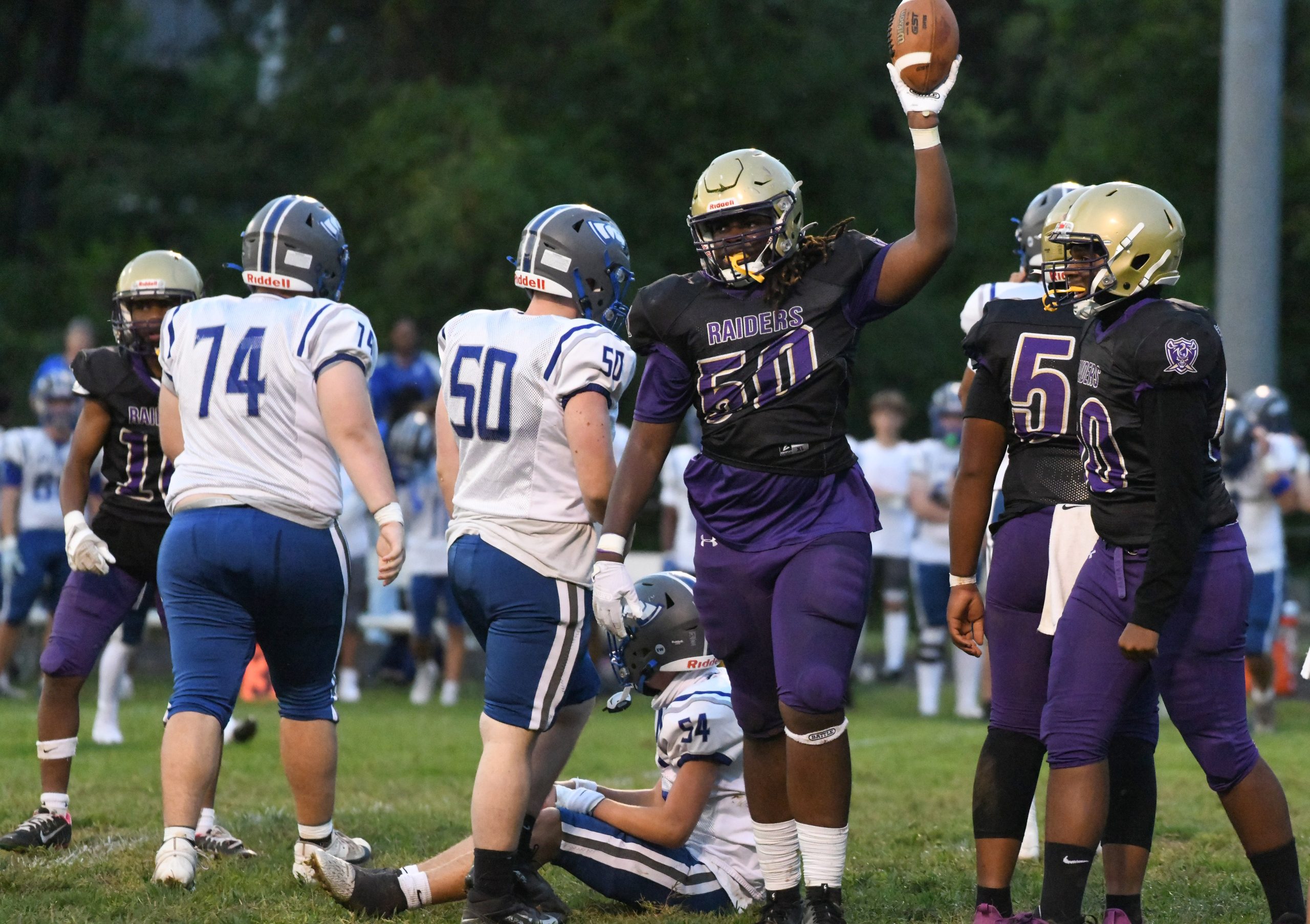 Loch Raven's Amire Moore celebrates a fumble recovery against Sparrows...