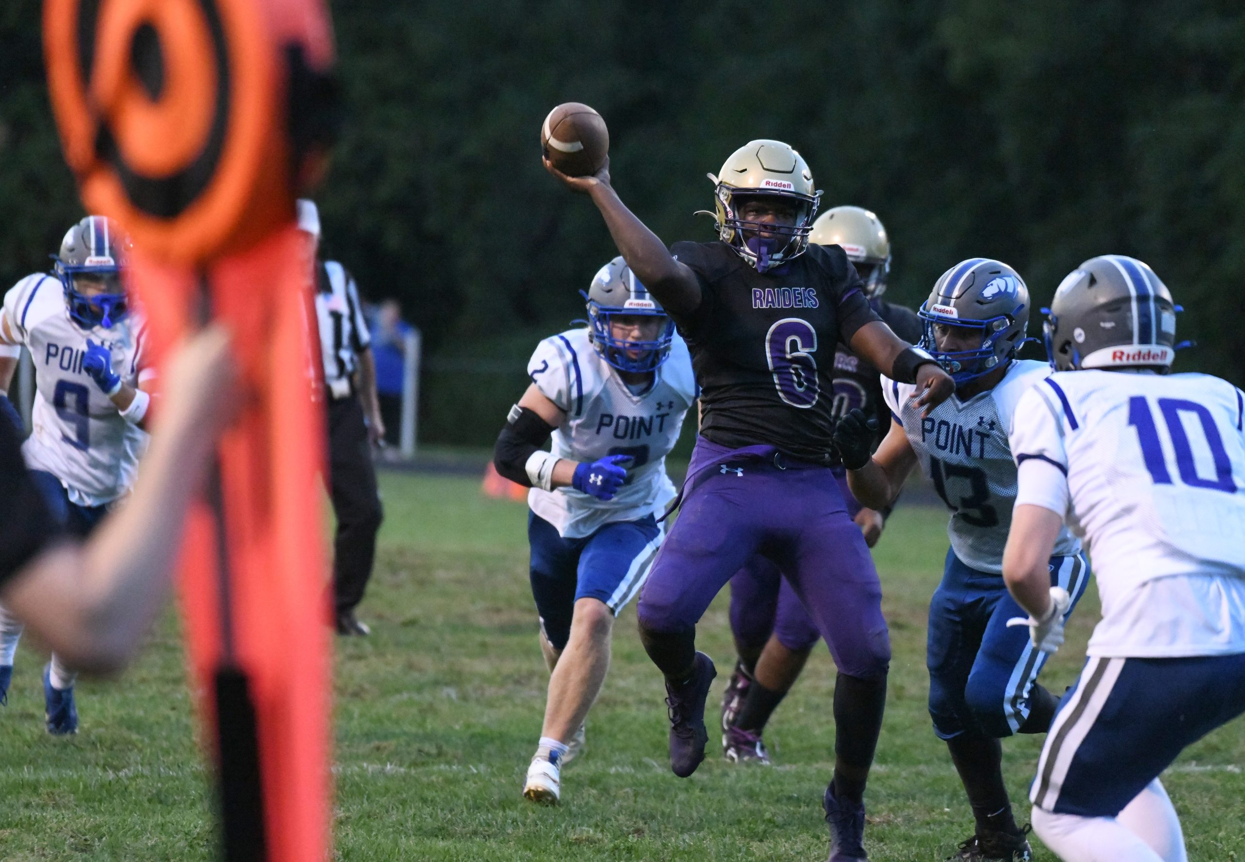 Loch Raven quarterback Cai Perry makes a throw on the...