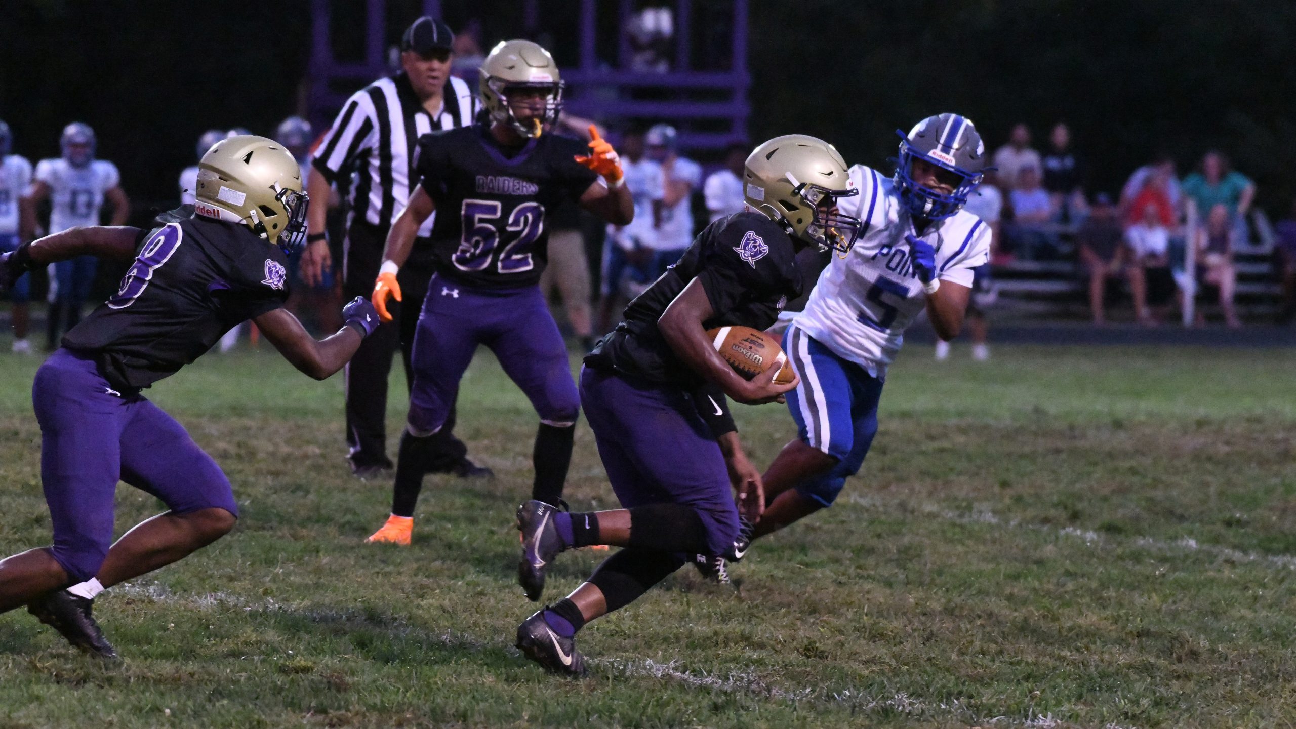 Loch Raven's #4 returns an intercepted pass against Sparrows Point...