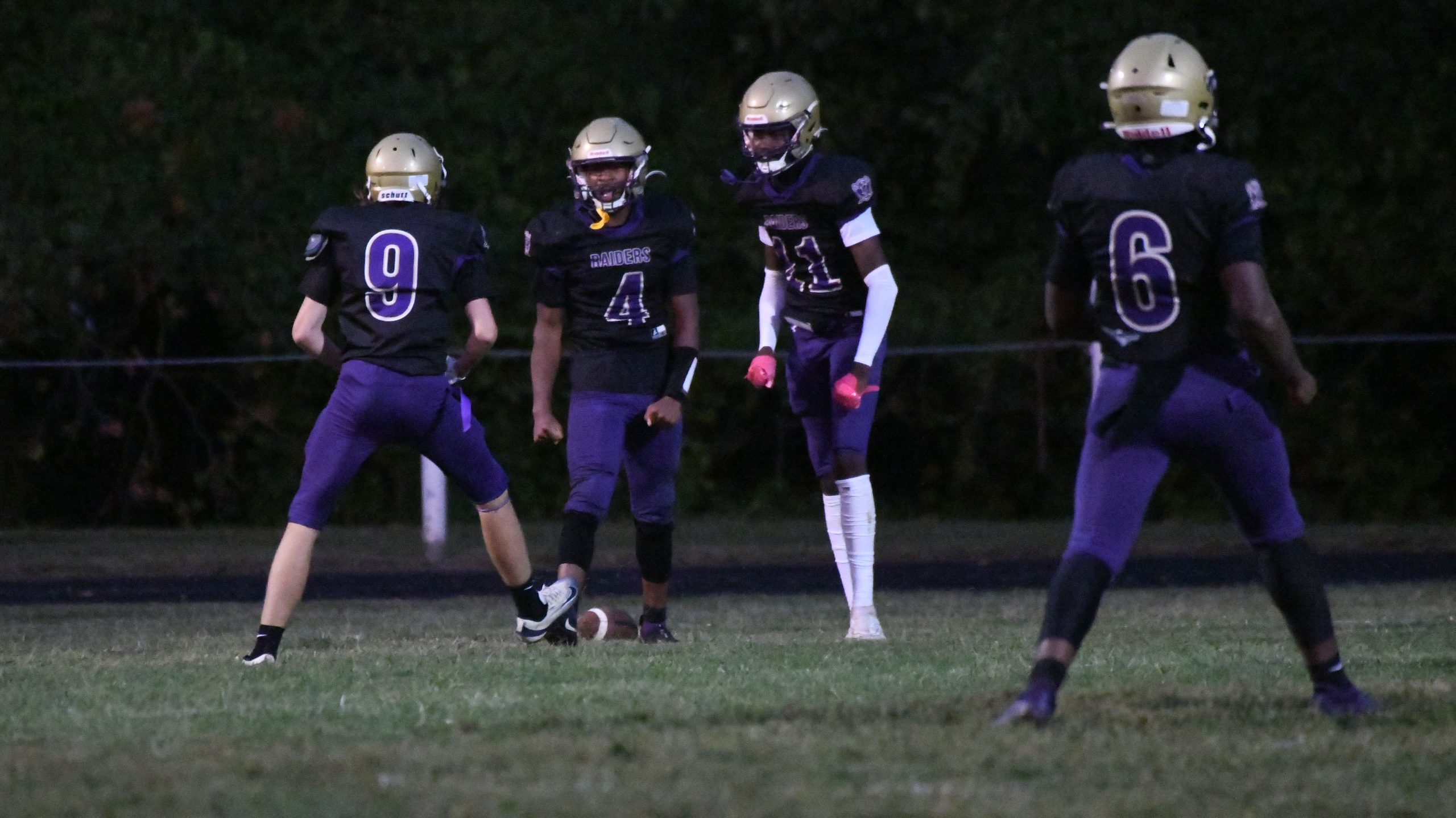 Loch Raven teammates celebrate a touchdown against Sparrows Point during...