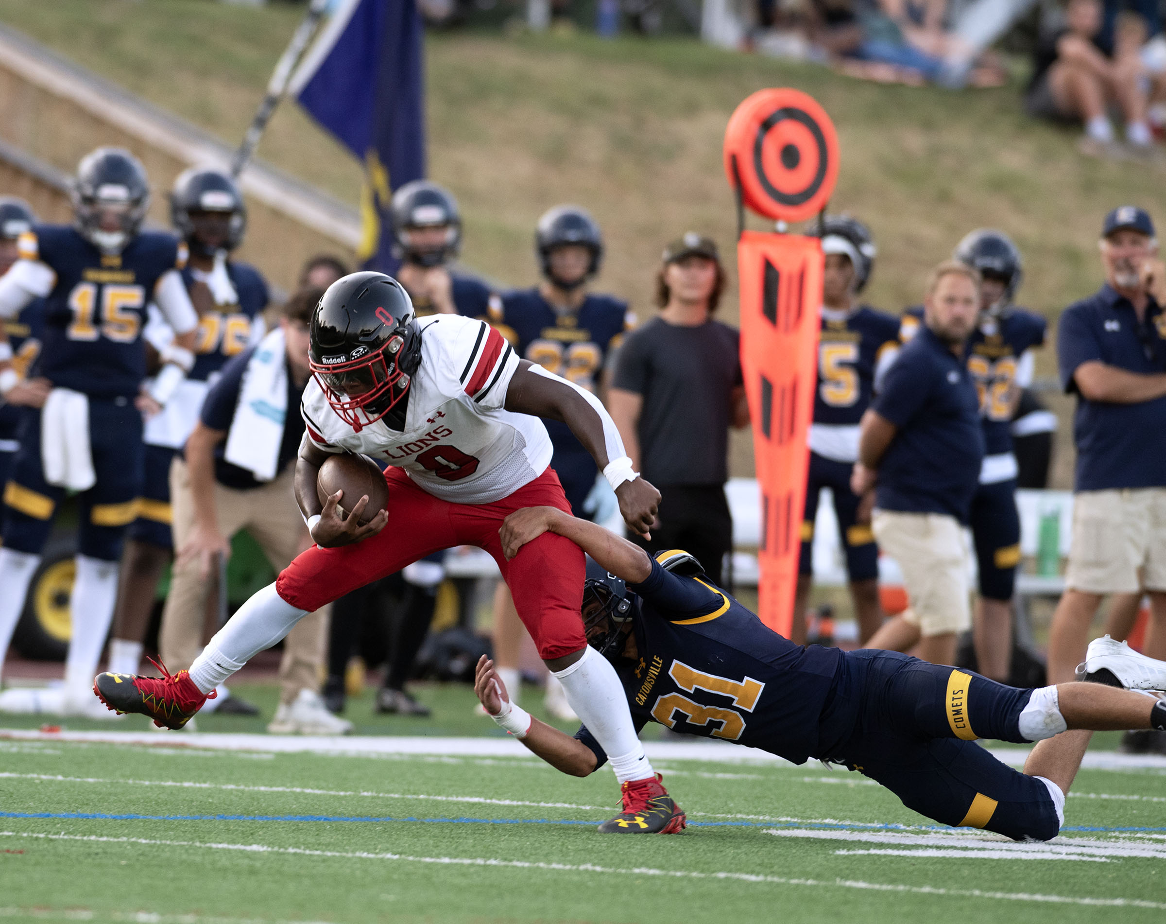 Dulaney's Brendan Taylor tries to shake Catonsville defender Roger Parham....