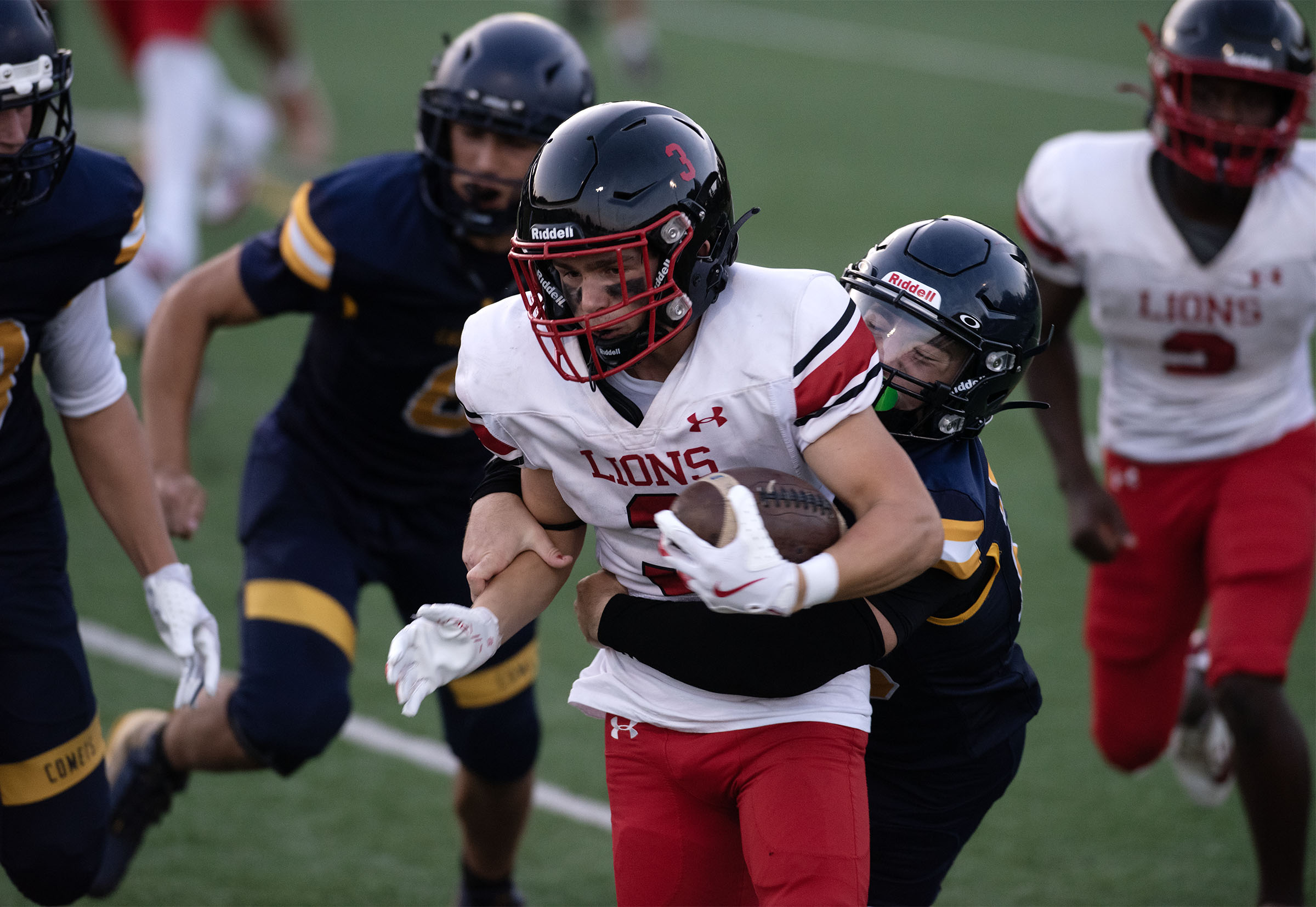 Sept. 12, 2025- Dulaney receiver Jacob Shuss is tackled by...