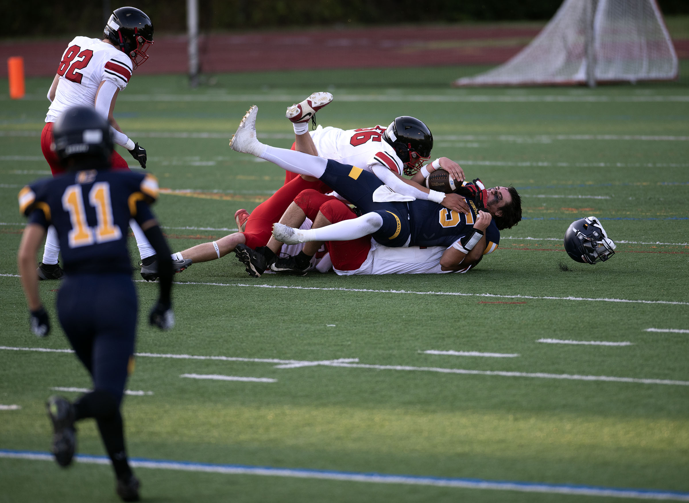 Sept. 12, 2025- Catonsville quarterback Evan Lindley loses his helmet...