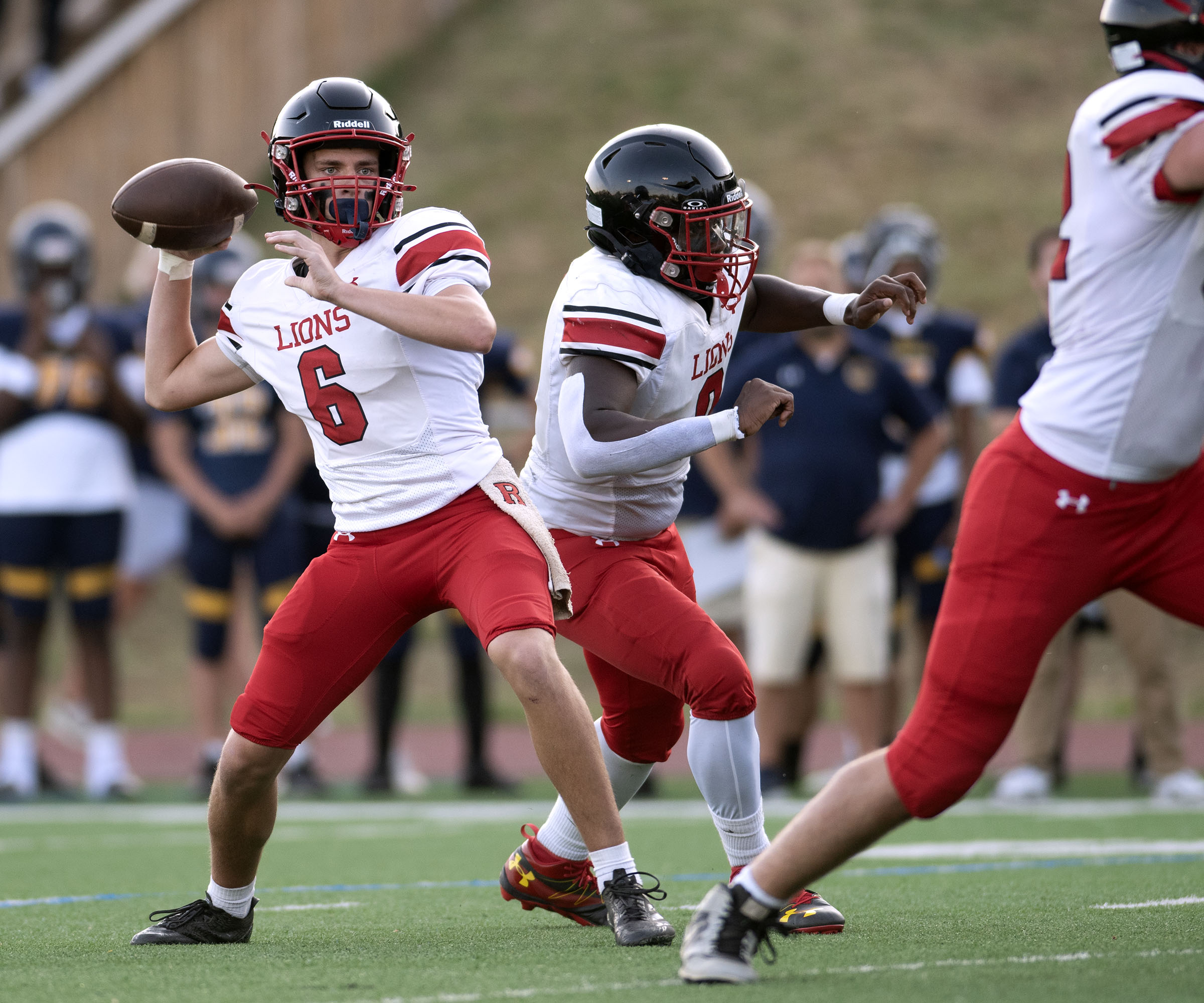 Sept. 12, 2025- Dulaney quarterback Josh Squires sends a pass...