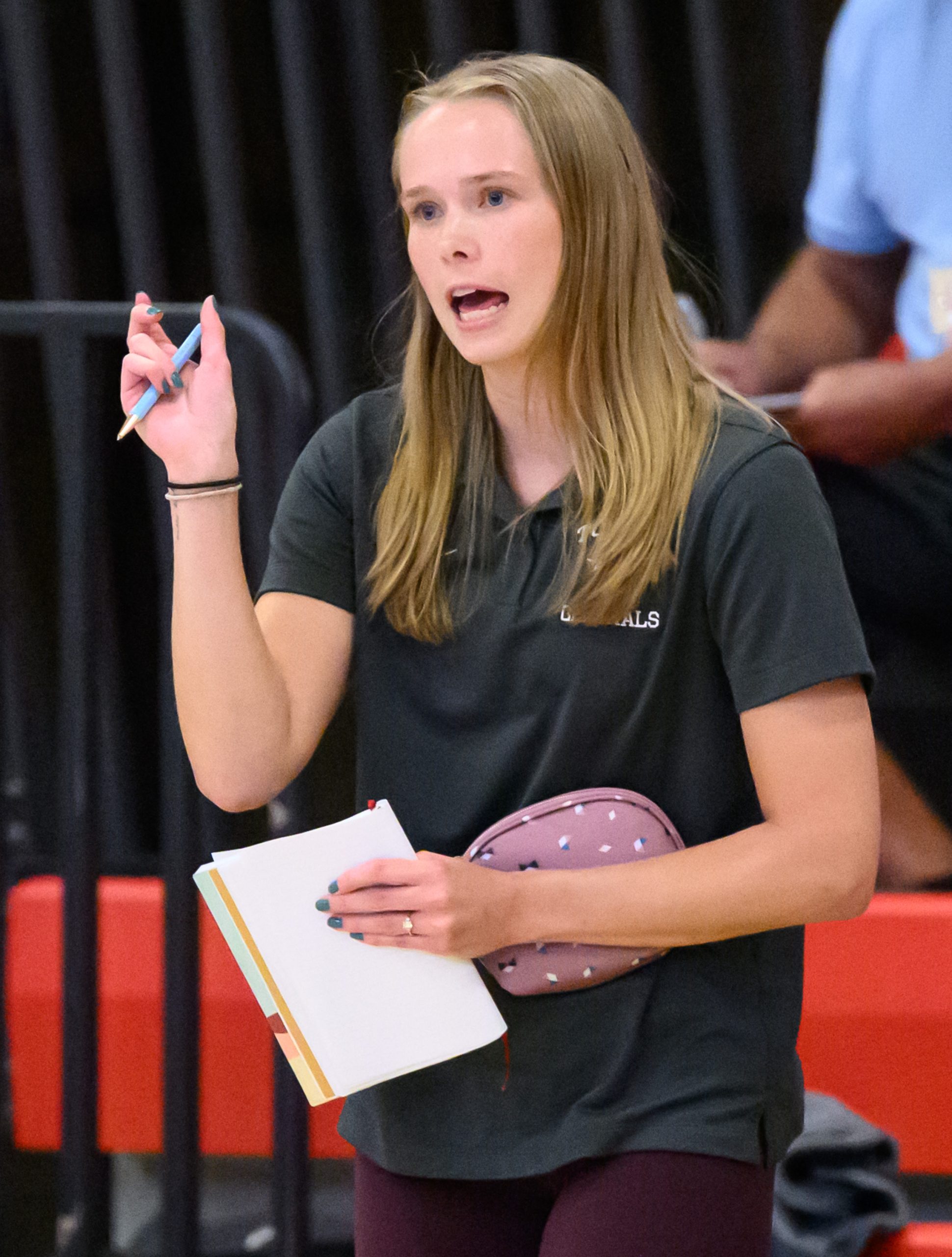 Towson head coach Morgan Puller leads her team against Dulaney...