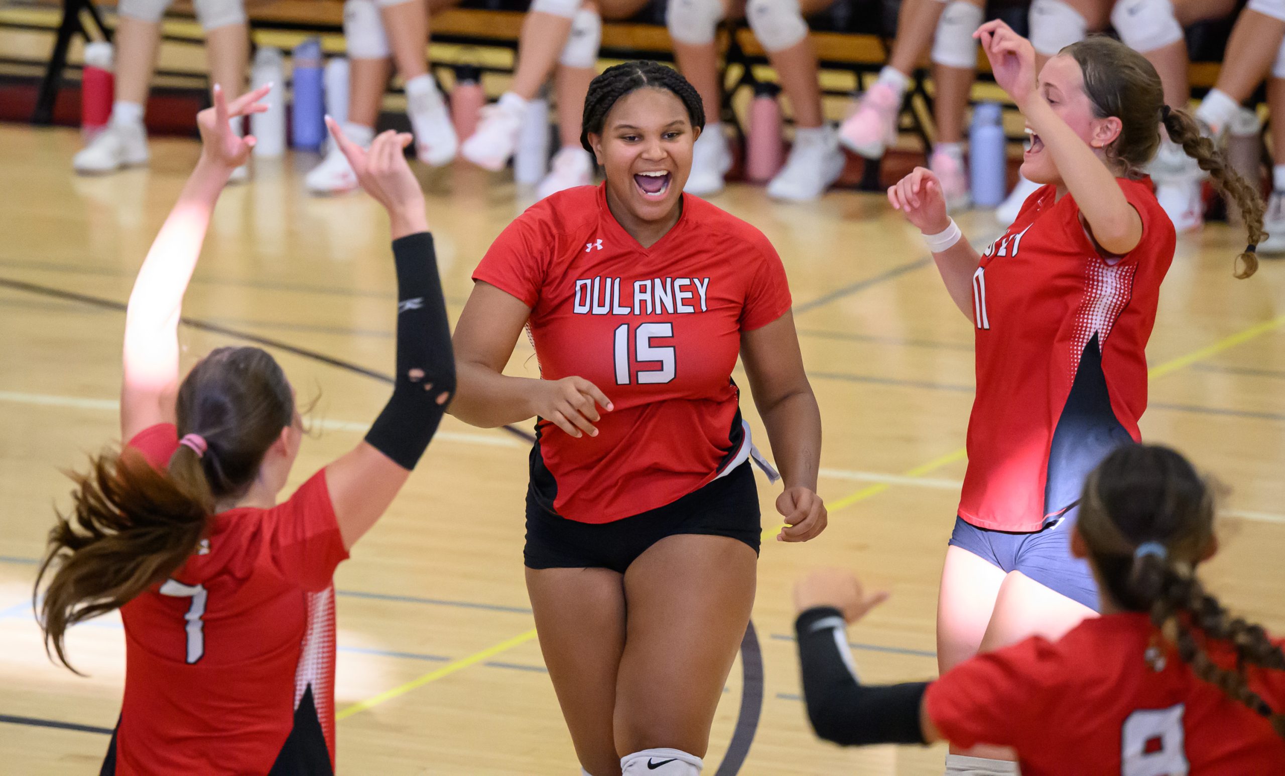 Dulaney’s Kira Logvin-Moore, #15, and Cami Reed, #11, celebrate a...