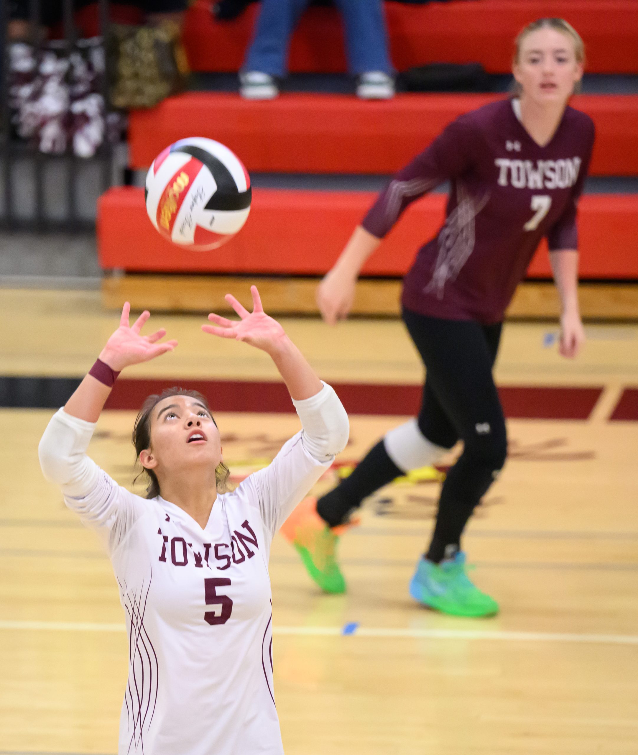 Towson’s Lila Gali, #5, sets against Dulaney as teammate Shawna...