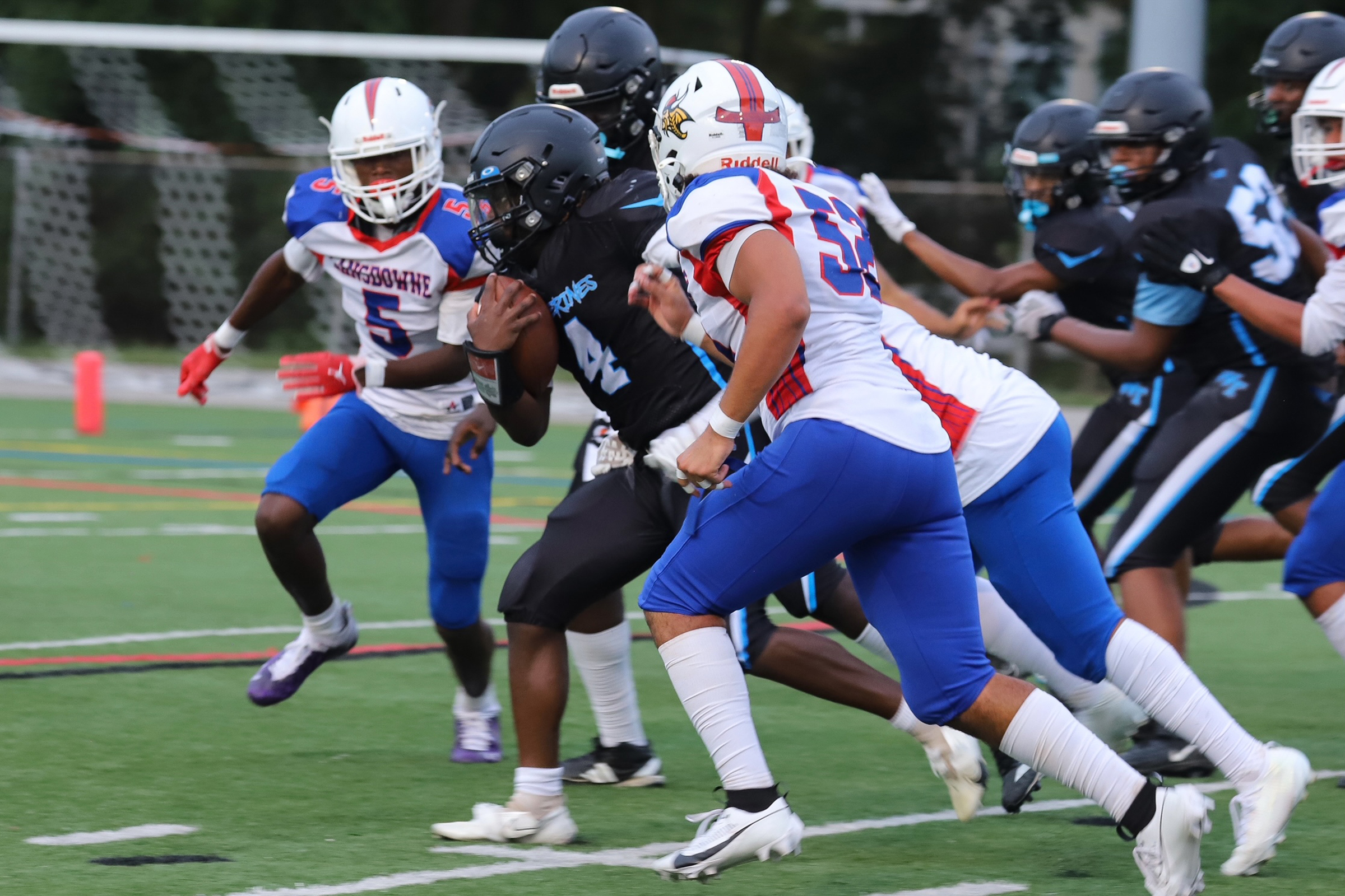 Western Tech’s quarterback #4 Anthony Laboo breaks through Lansdowne’s defense....