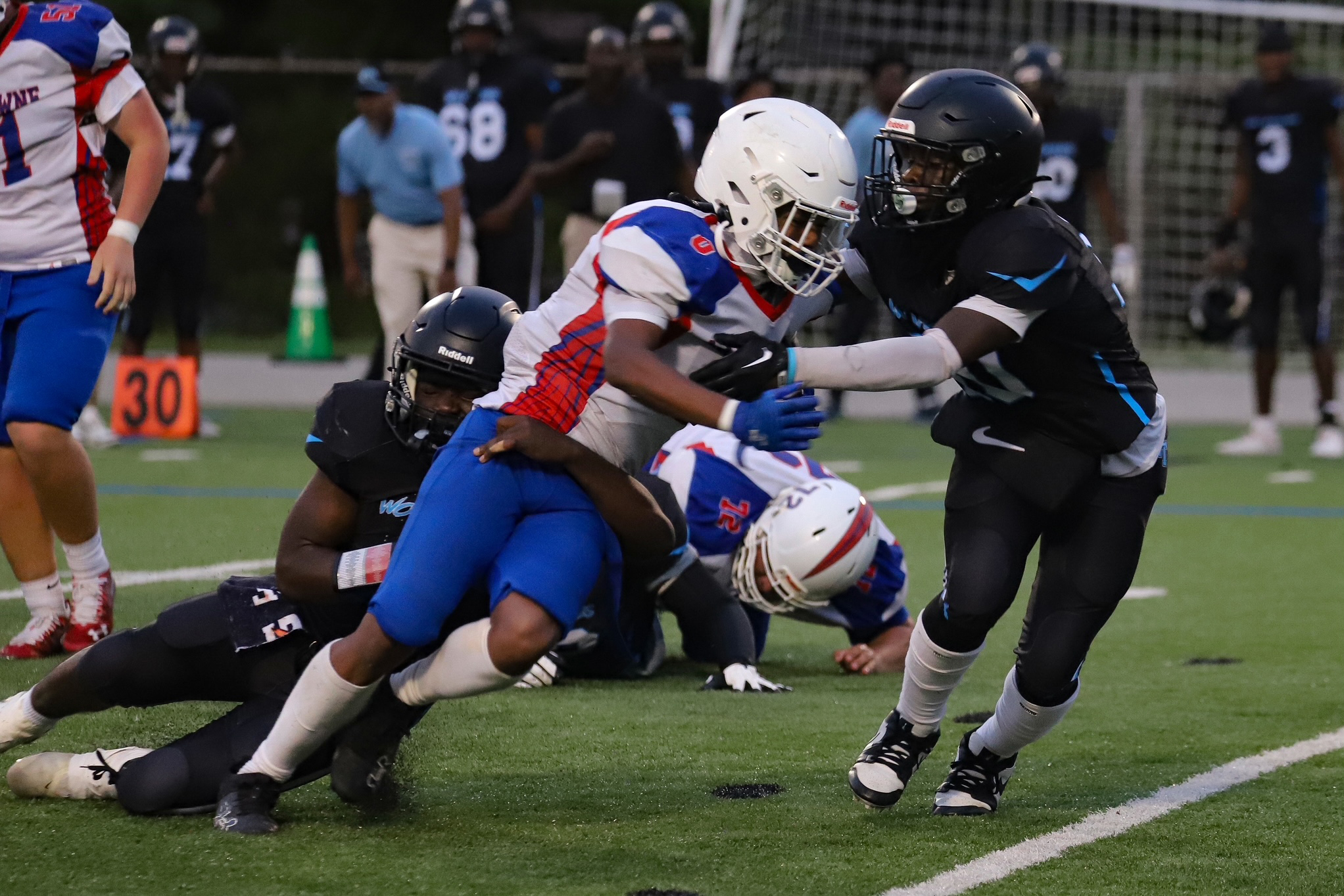 Western Tech’s defensive players, safety #4 Anthony Laboo and linebacker...