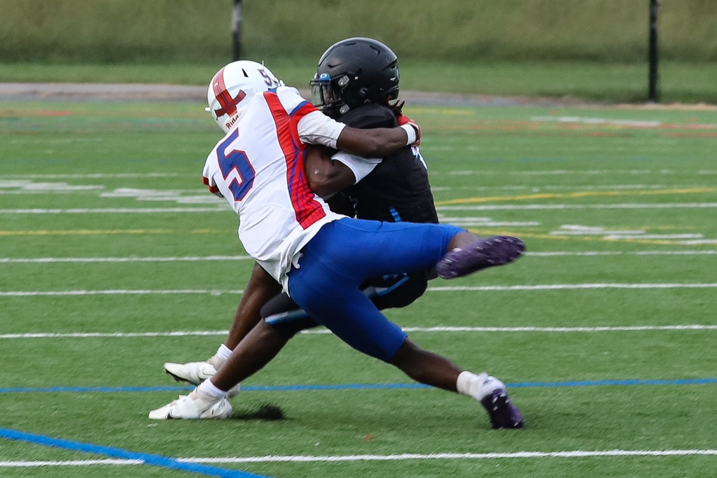 Lansdowne’s defensive back #5 Ryhelm Parker stops Western Tech’s running...