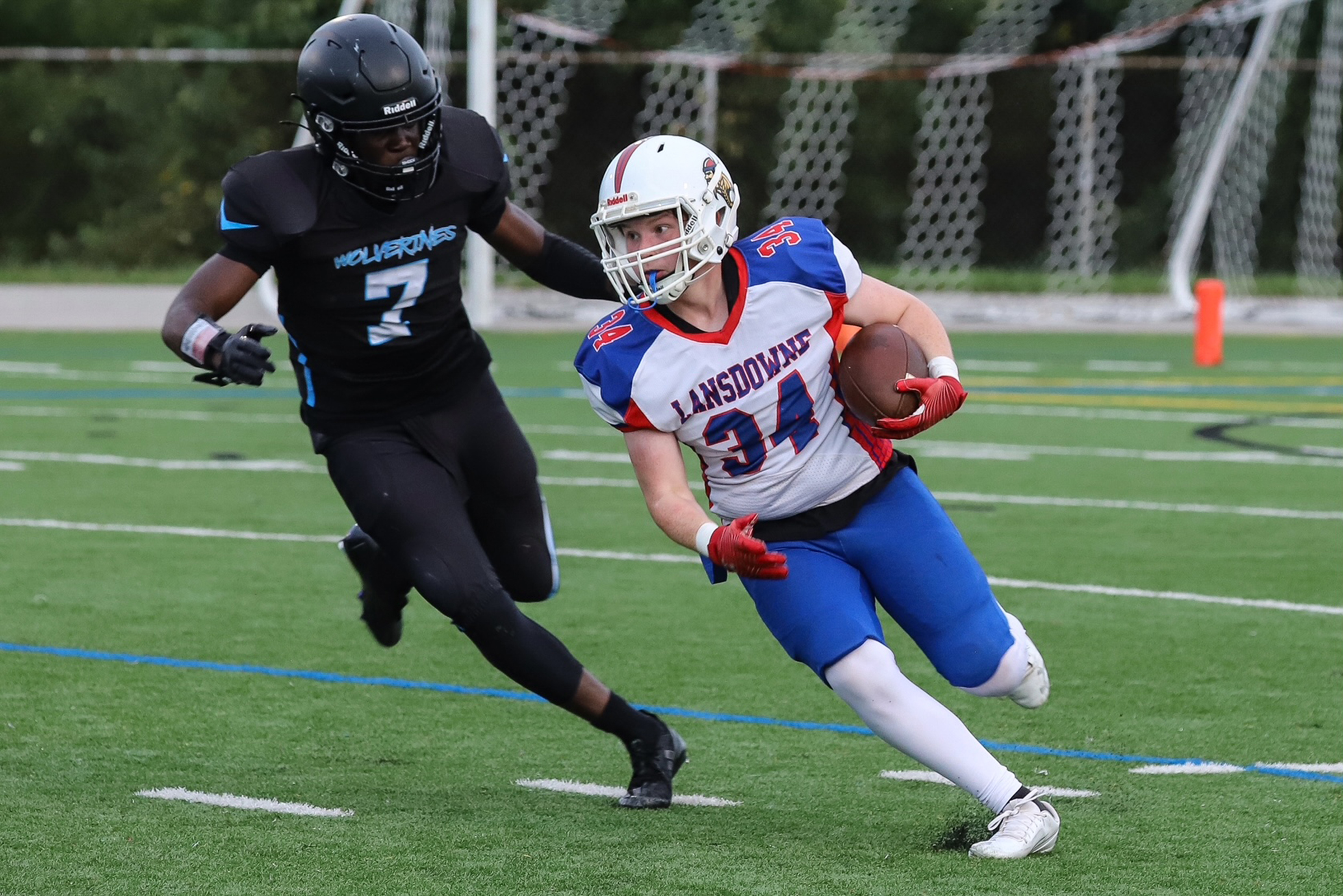 Lansdowne’s running back #34 Bryce Trent runs past Western Tech’s...