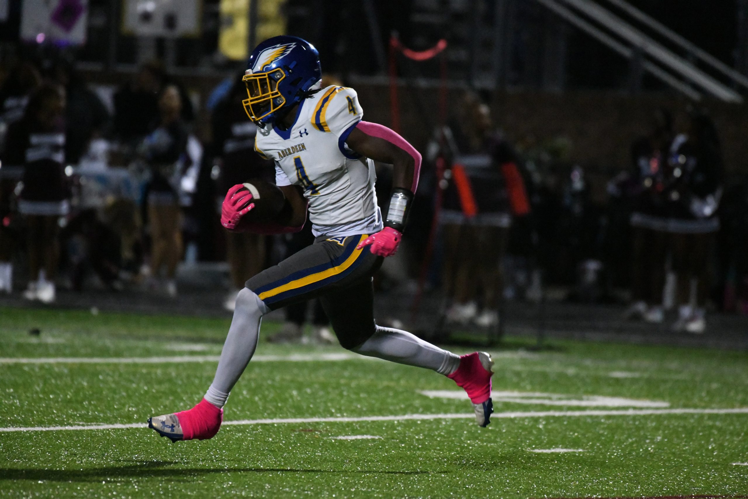 Aberdeen's Tevonte Williams returns a kick off during a football...
