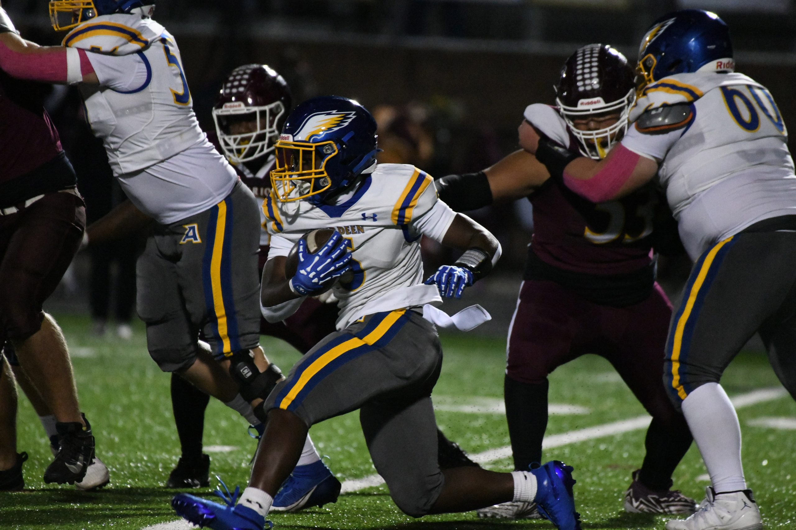 Aberdeen's Cameron Durbin carries the ball during a football game...