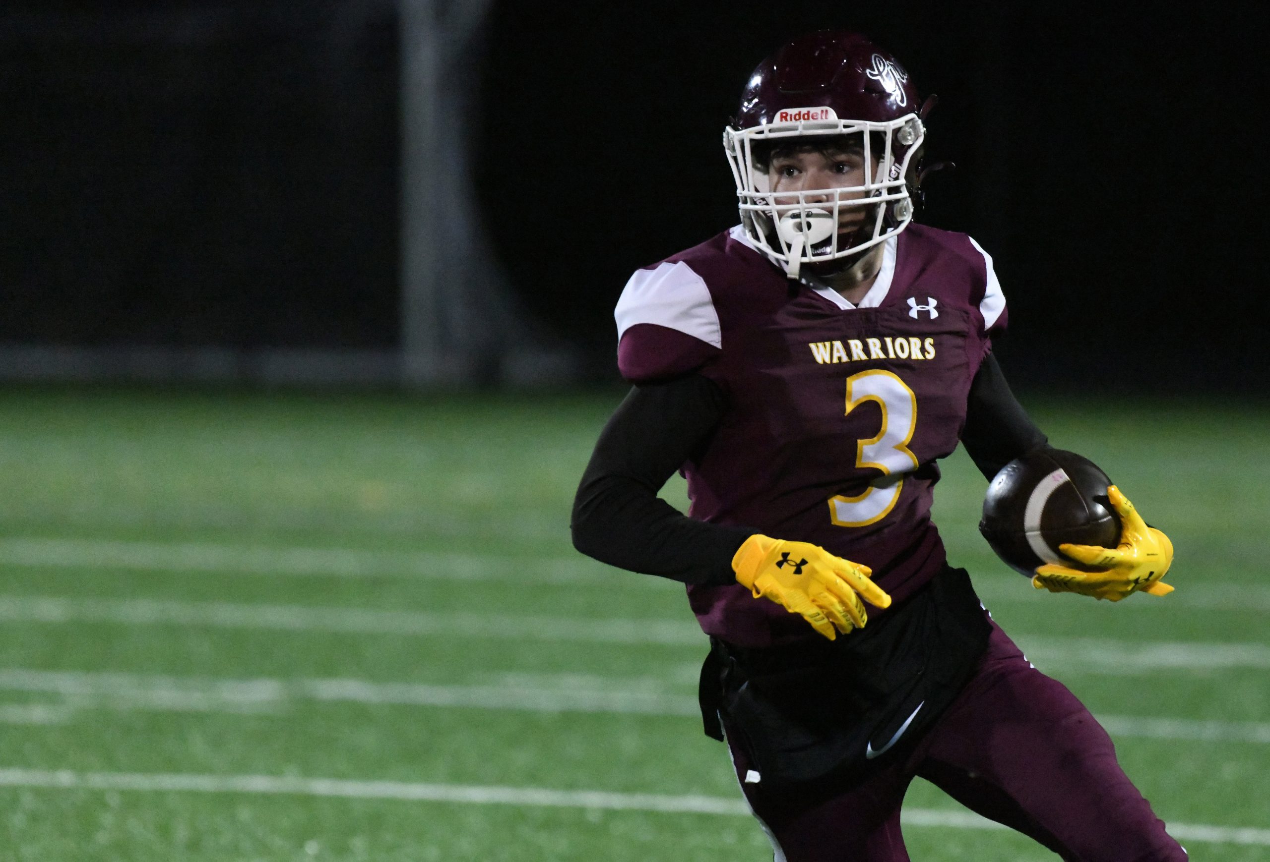 Havre de Grace receiver Miles Miller runs up the field...
