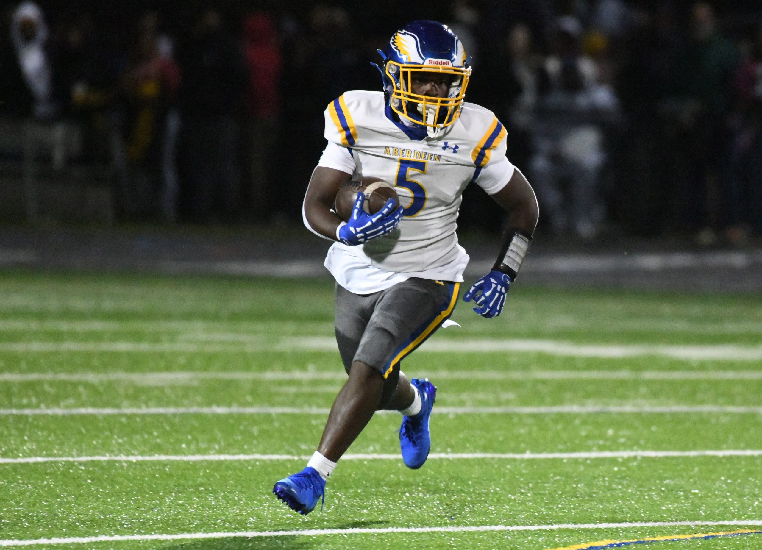 Aberdeen's Cameron Durbin runs up the field with the ball...
