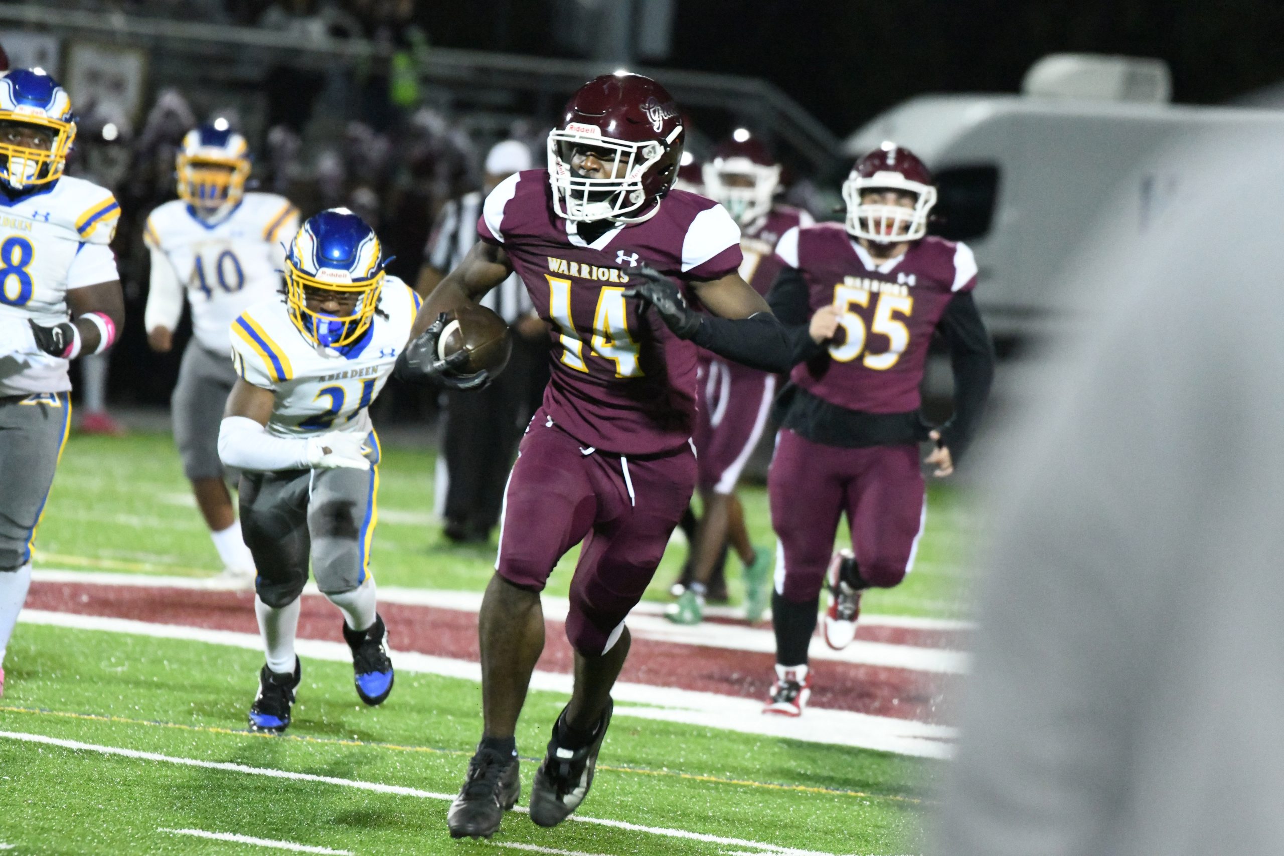 Havre de Grace's Josiah Lawrence runs up field after a...