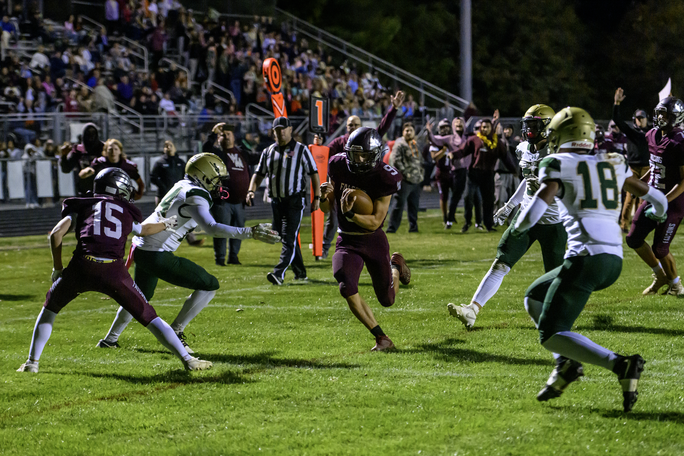 Winters Mill's Luke Phillips runs for one of his two...