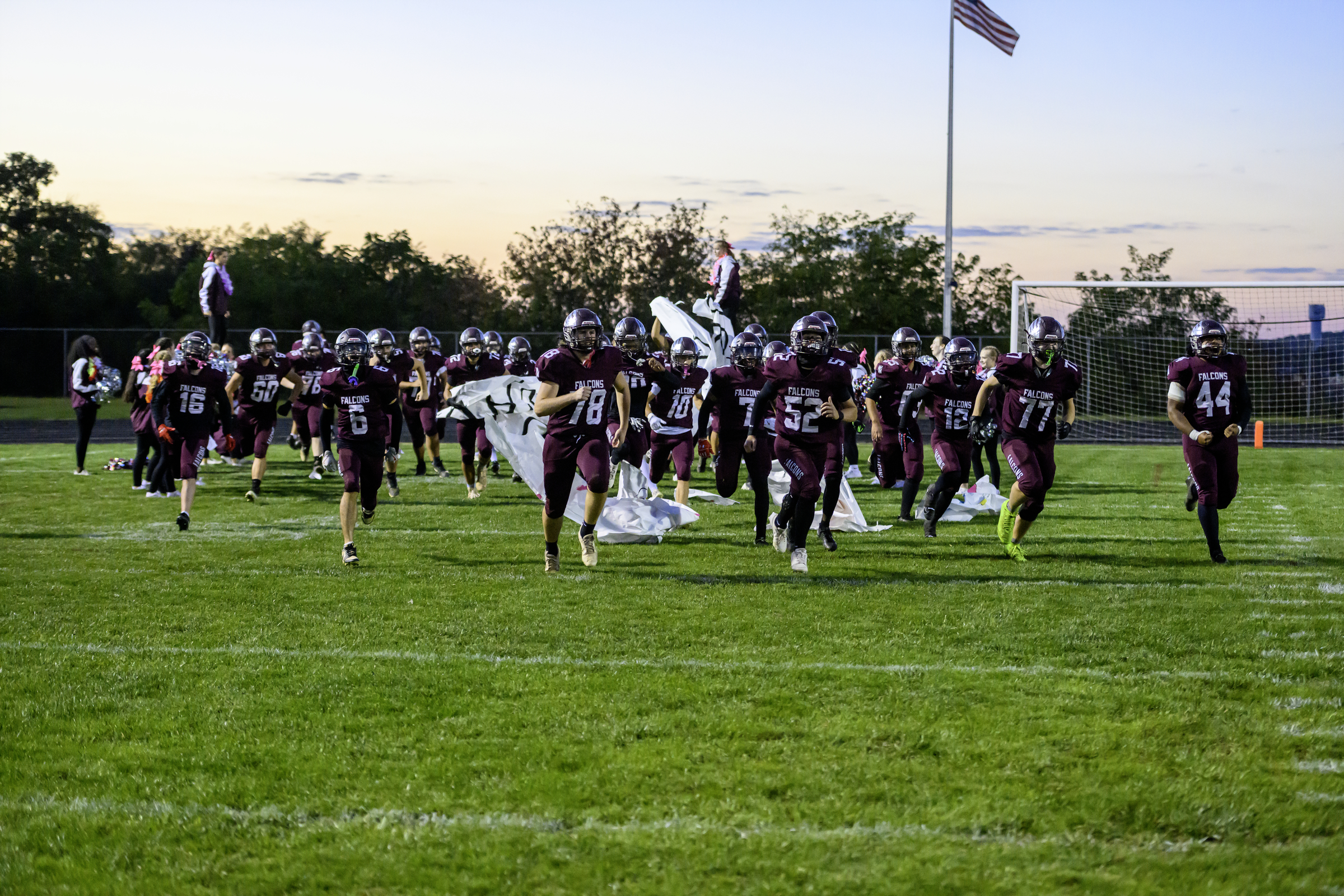 The Falcons take the field prior to a football game...