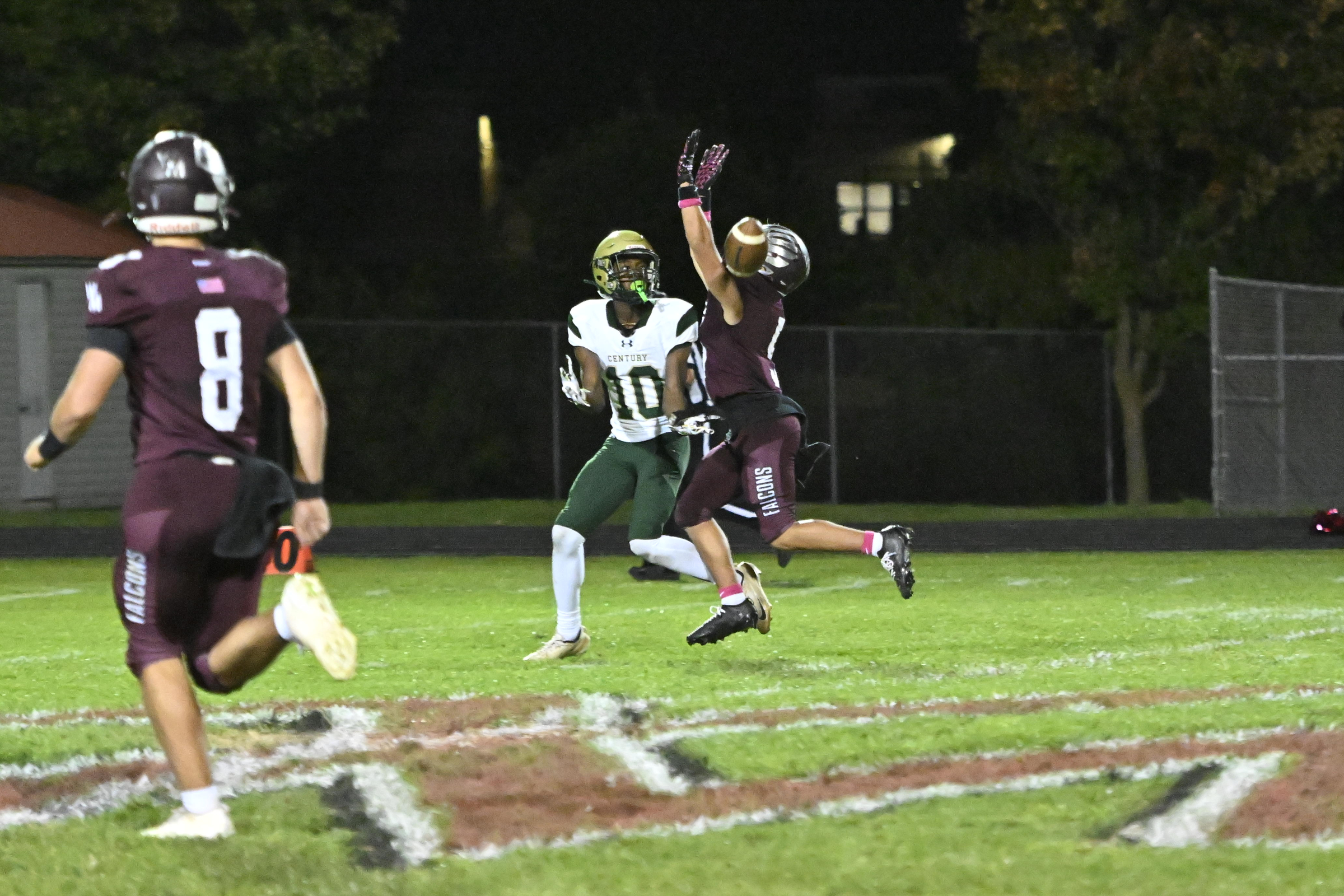 Jake Andolina breaks up a pass intended for Century's Ethan...