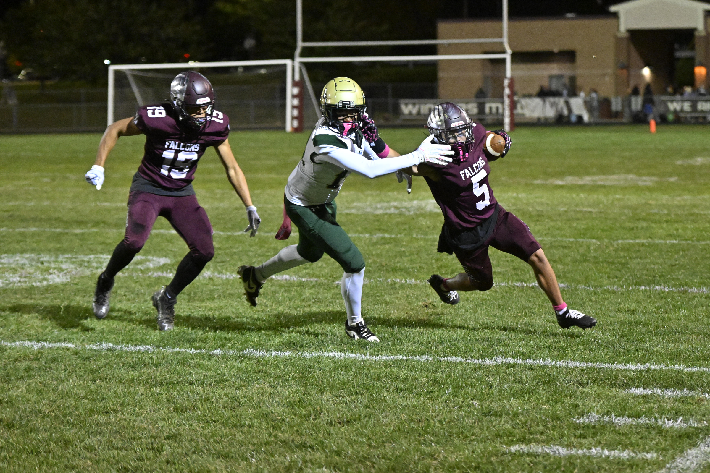 Jake Andolina tries to avoid the tackle of Century's Desmond...